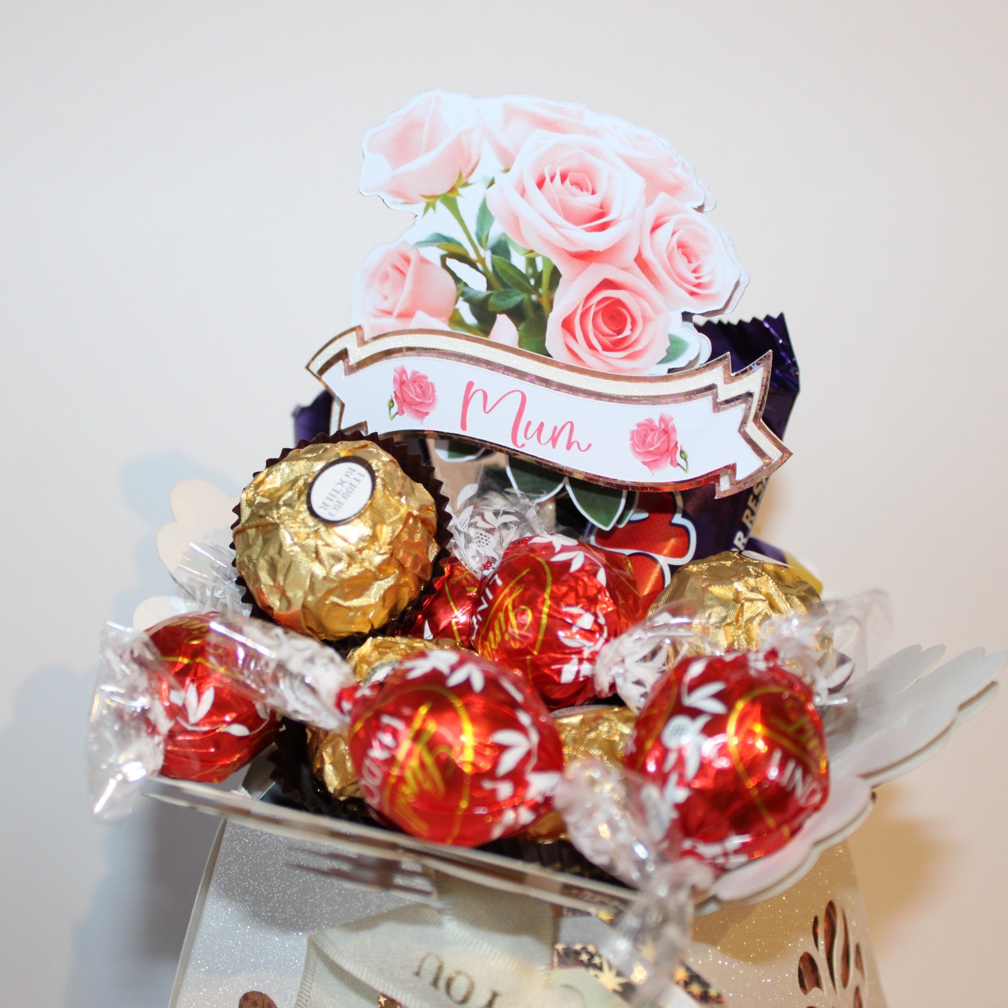 Vase is filled with your favourite sweet treats to suit Mum for a bespoke, thoughtful present. Designed to sit beautifully on a mantel, windowsill, or breakfast table. 