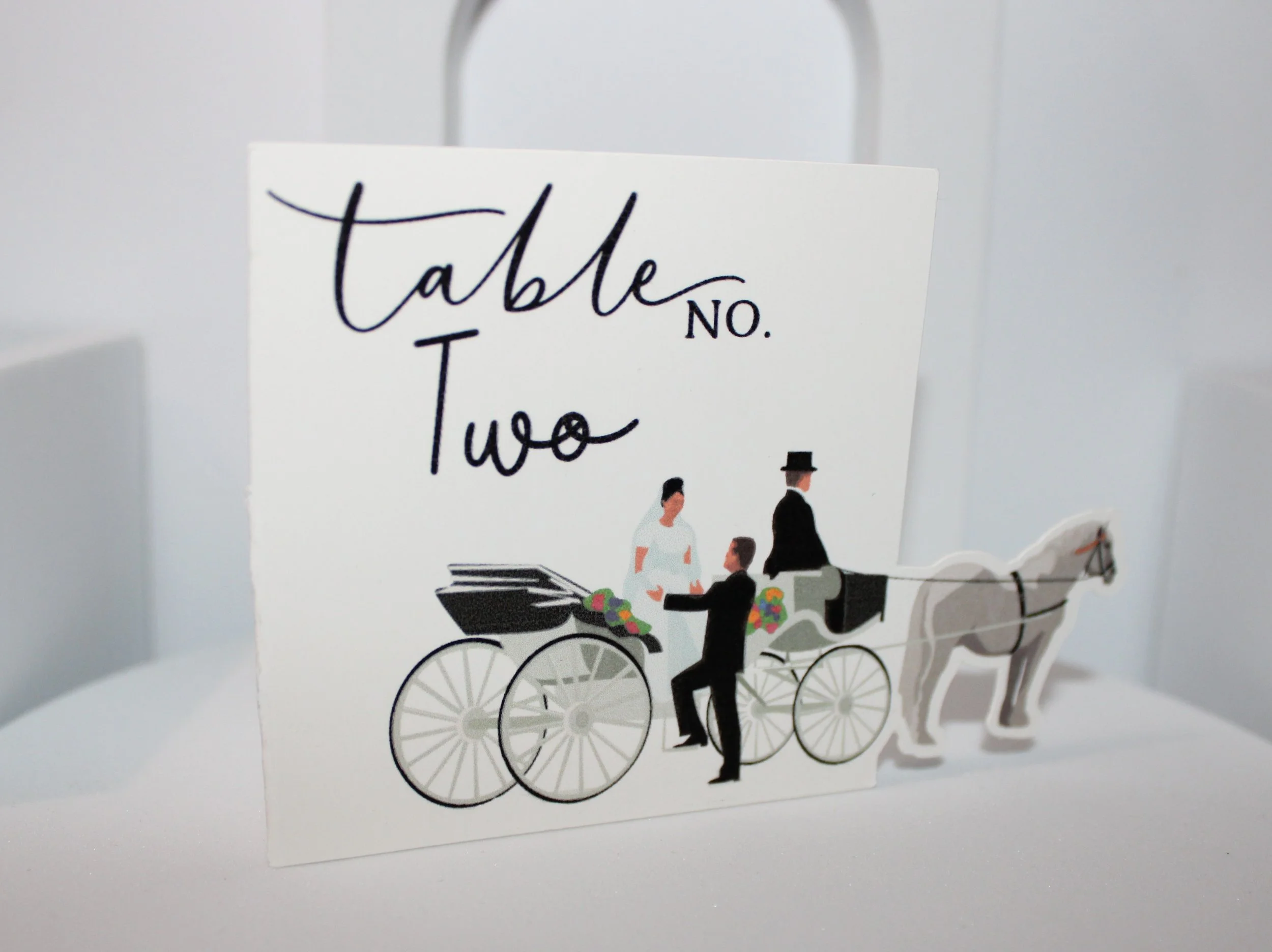 Horse & carriage table number!

These aren’t just any cards, they feature a beautiful design that bleeds off the edge. A unique card that looks absolutely gorgeous on every table. The best part is they perfectly capture that whimsical romantic vibe t