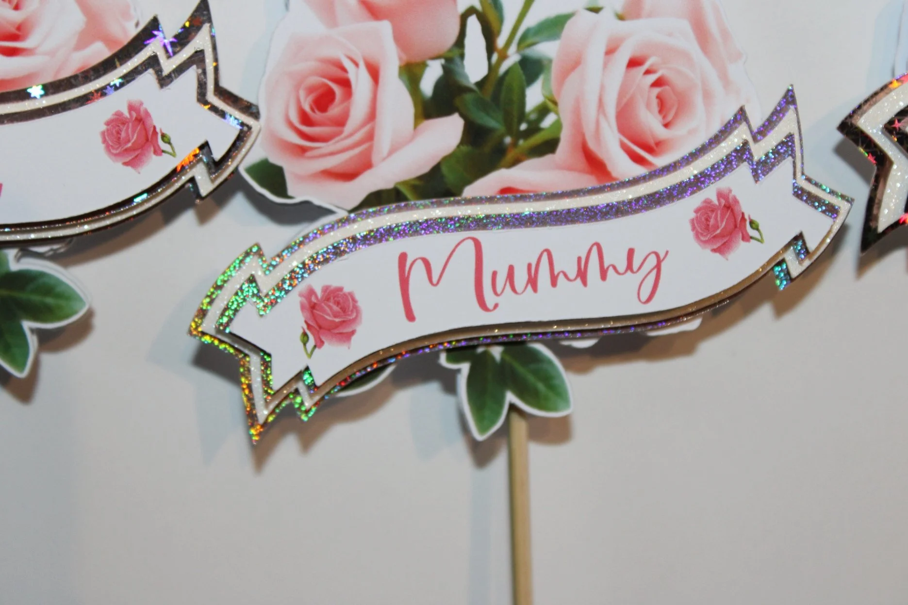 Beautifully printed roses and a banner with your special persons name attached. These really are a must have for any bouquet. 