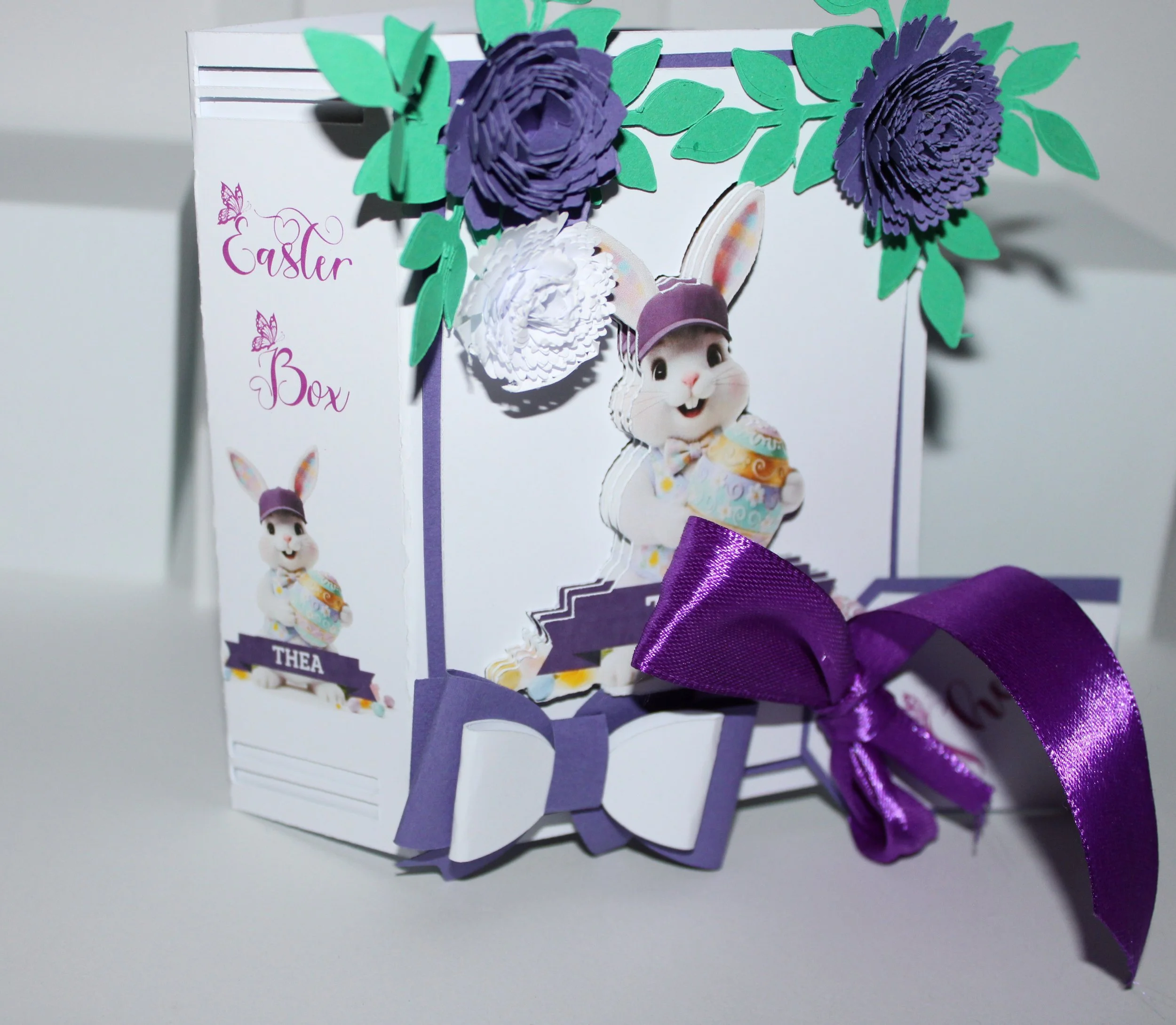 The spine is inscribed with "Happy Easter" alongside the recipient’s name, creating a keepsake-ready presentation that doubles as seasonal décor