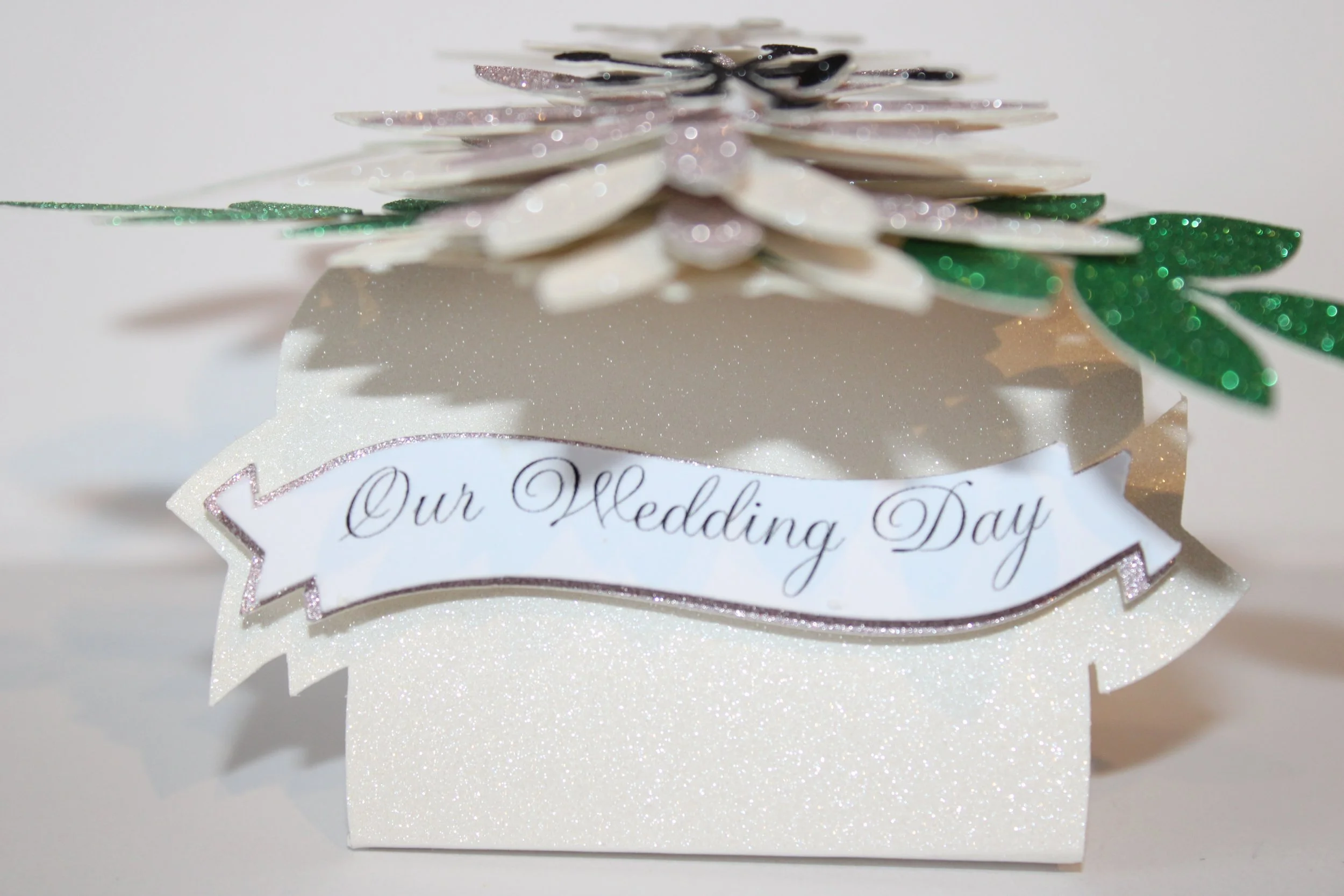 Our wedding day banner is hiding under the flowers.