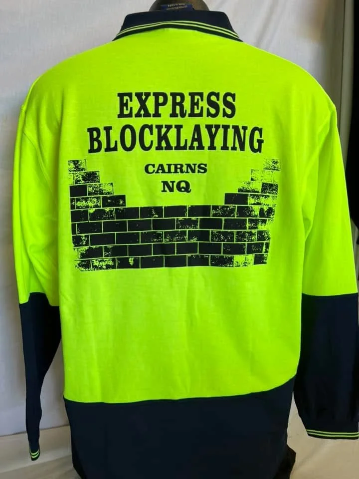 Back of a neon yellow and black jacket with text 'EXPRESS BLOCKLAYING CAIRNS NQ' and a graphic of a partially built brick wall.