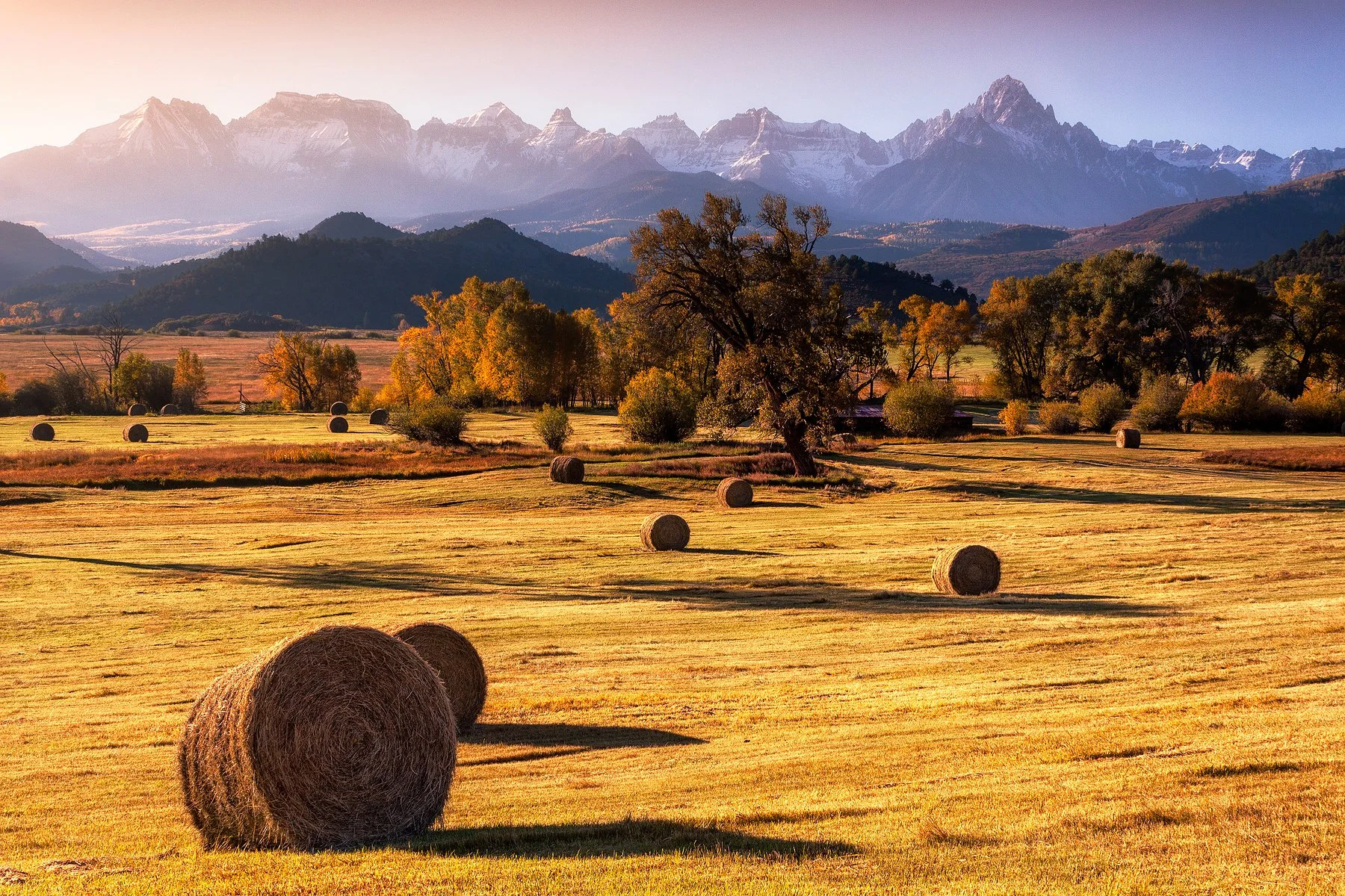 Hay bales on Ralph Lauren's ranch near Ridgway under the stunning backdrop of the massive Sneffels Range