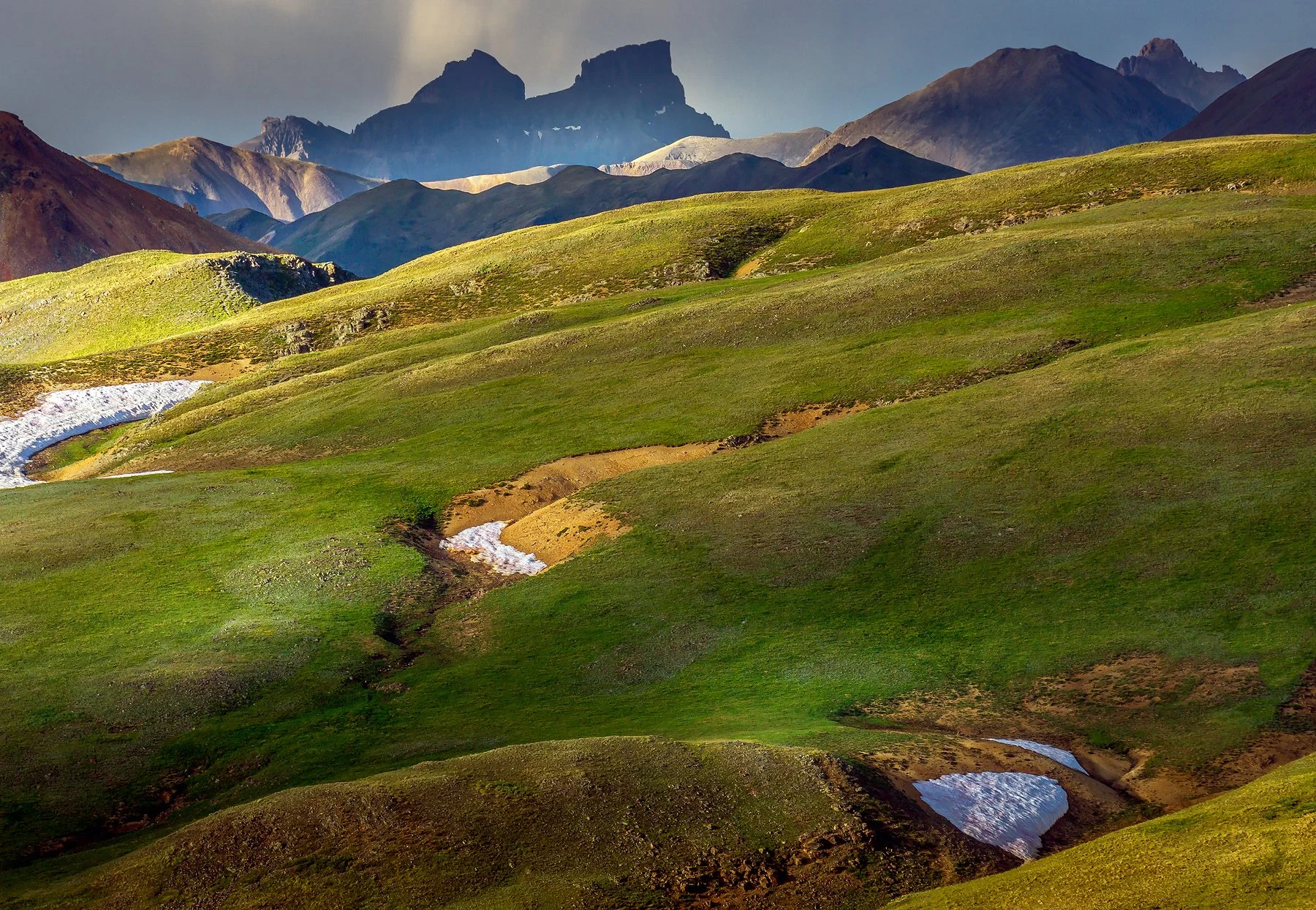 14,000 foot Wetterhorn Peak in the distant right and high 13ers of Coxcomb and Red Cliff peaks upper center from summit of unnamed 12,000 foot peak