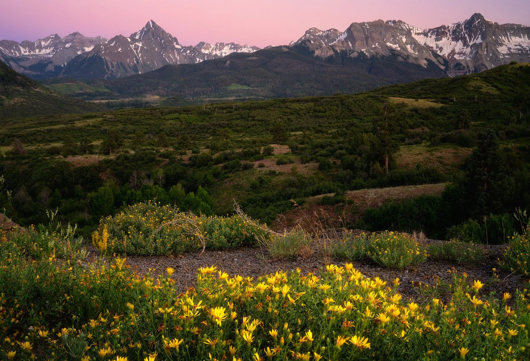 The Sneffels Range from a large overlook just below the summit of Dallas Divide with 14,158 foot Mt Sneffles in the distant left