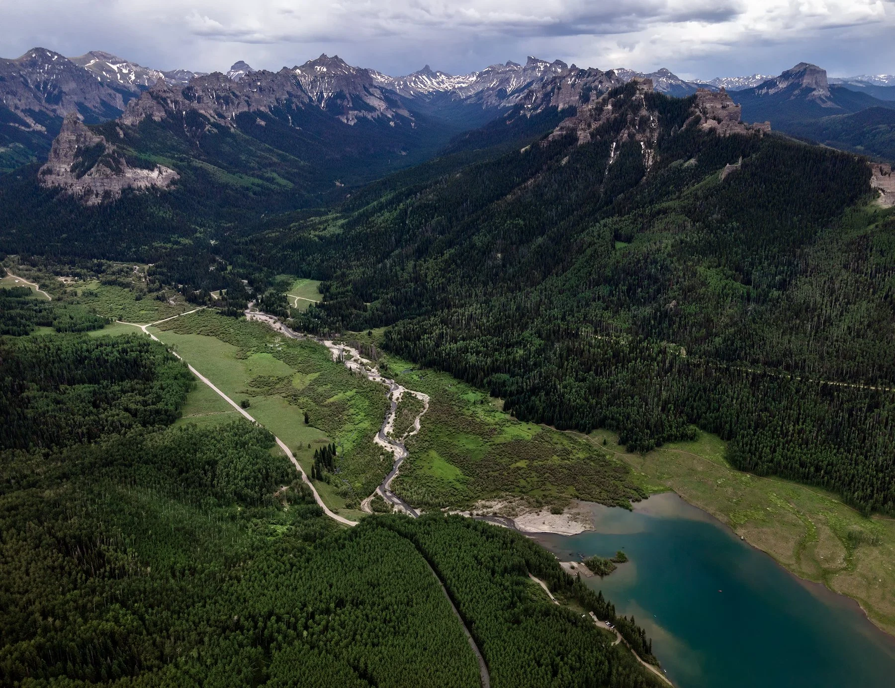 The Stunning Cimarron Mountains from atop a hight mesa above Silverjack Reservoir. 14,318 foot Uncompahgre Peak and 14,021 foot Wetterhorn Peak are seen in the distance