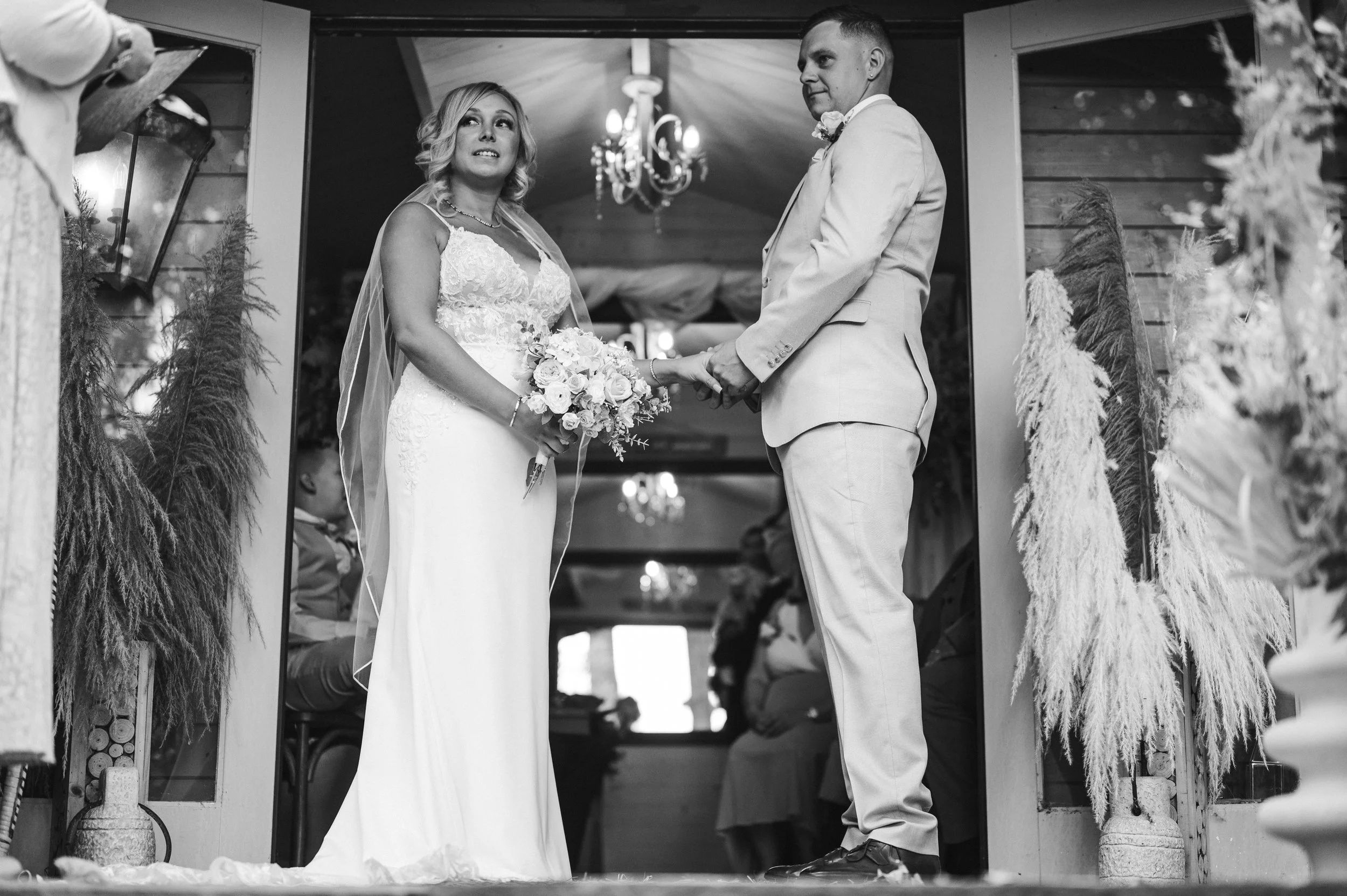 The Love Shack - Black and white image of groom and bride in wedding attire