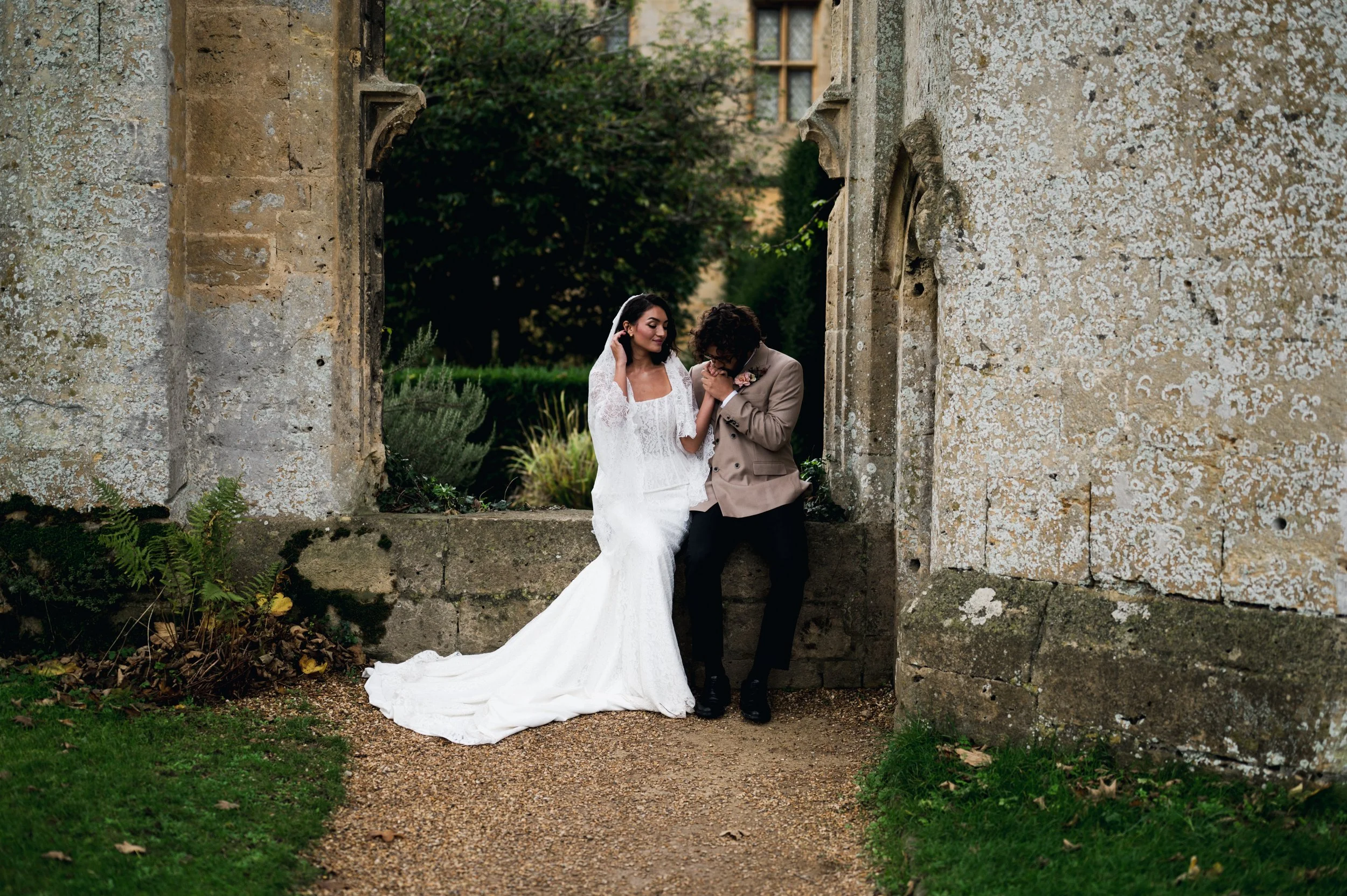 Sudeley Castle wedding photography – bride and groom kissing outside