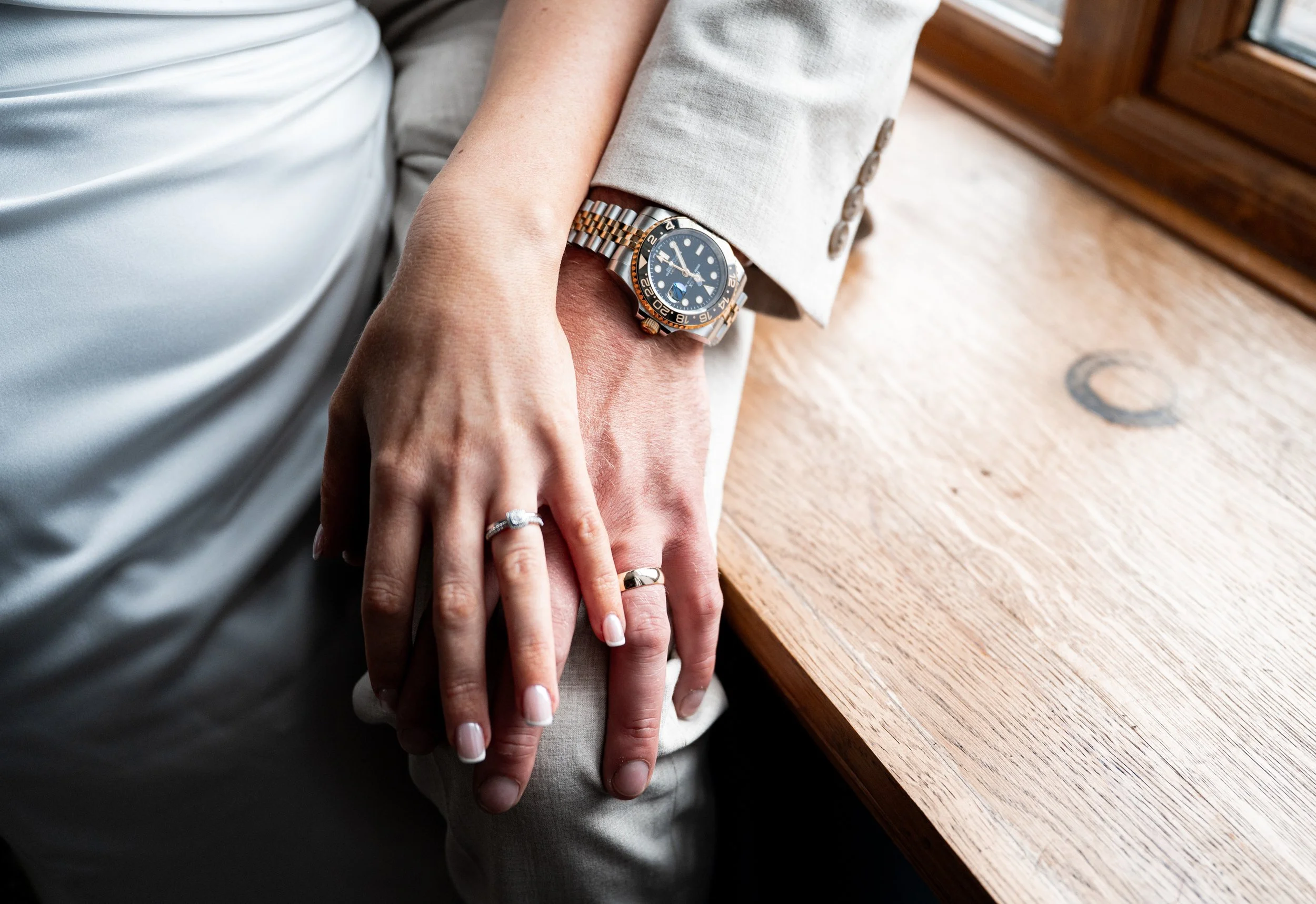 Peckforton Castle - hands of the bride and groom showing new wedding rings