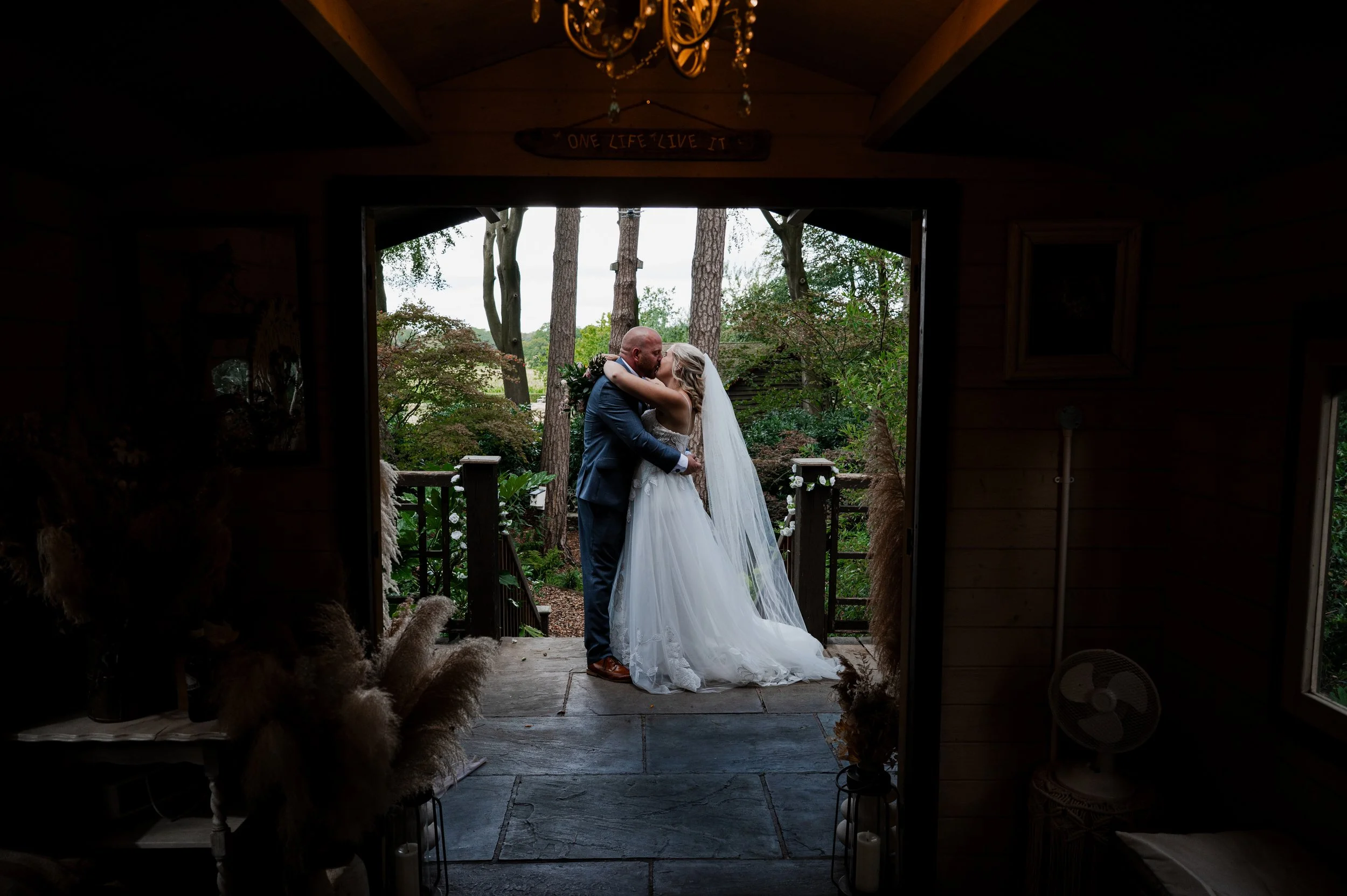 Wedding Photography Cheshire - Bride and groom in wedding attire kissing after a wedding ceremony