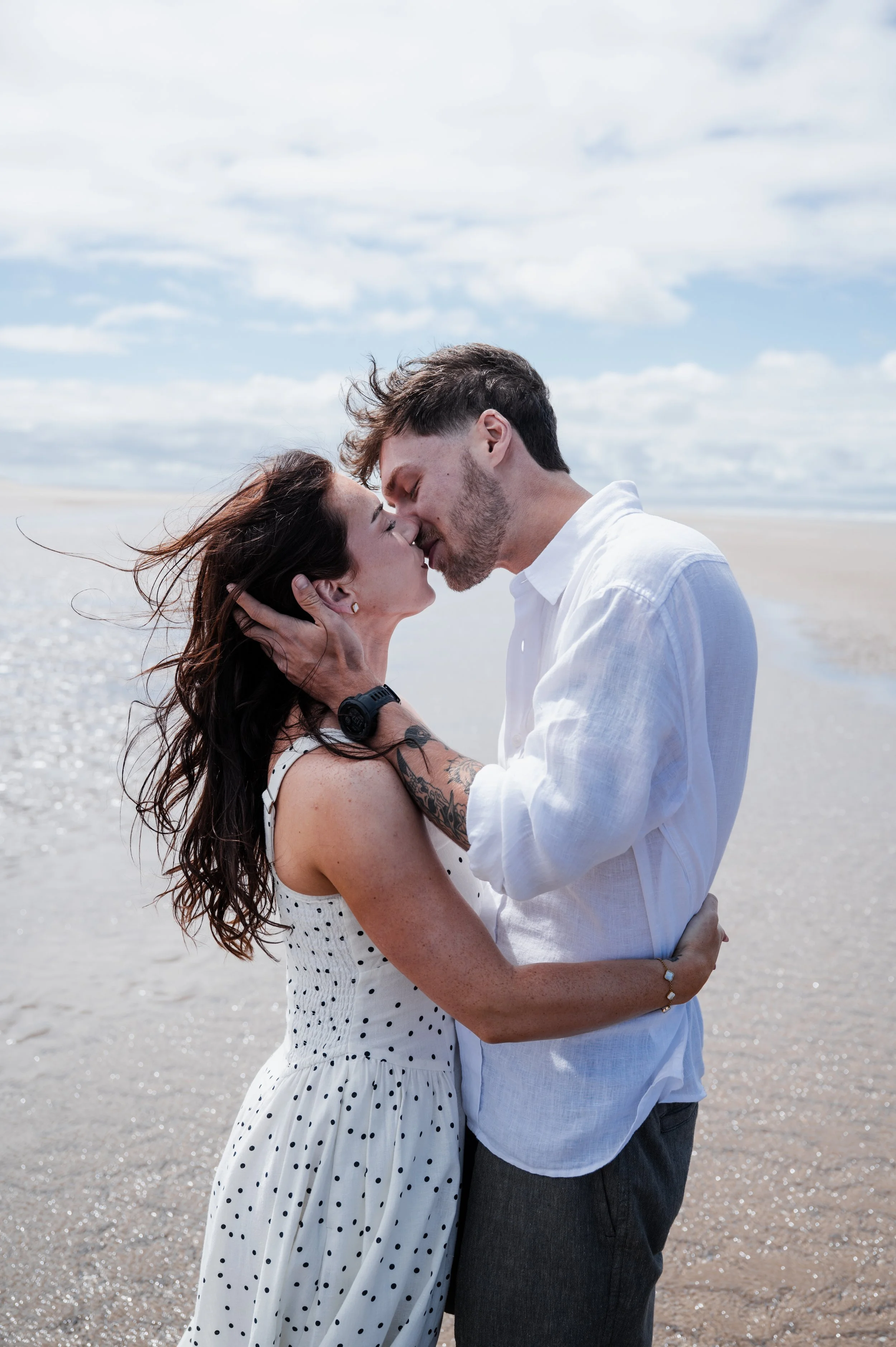 Engagement Photography Cheshire - Man and woman stood on the beach and kissing