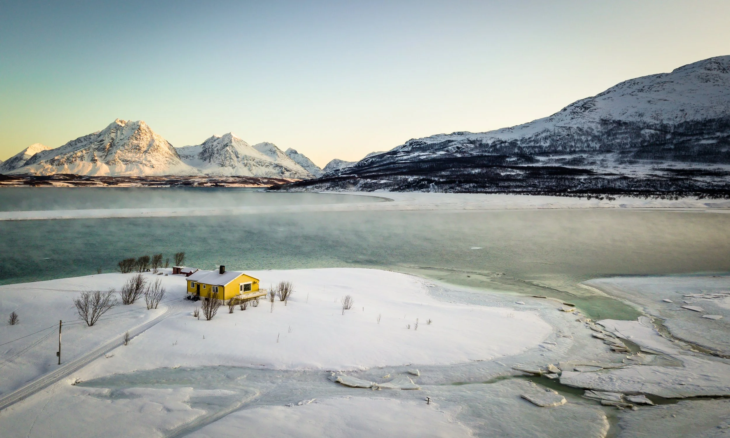 Yellow Cabin in the Frozen Fjord, Tromsø