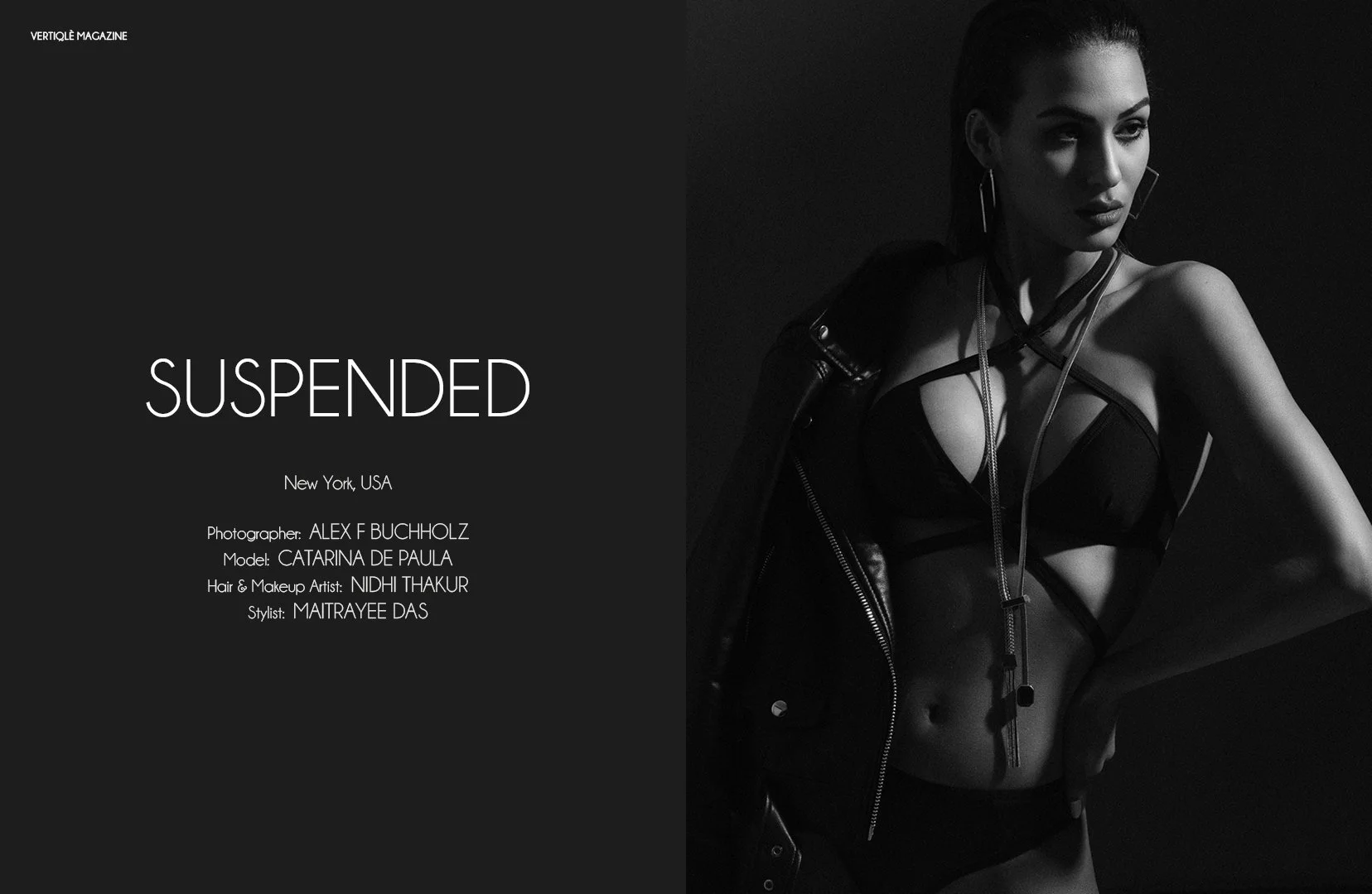 Black and white magazine cover titled 'Suspended' featuring a female model in a leather jacket, bra, and underwear with jewelry, posed with one hand on her hip and looking to the side.