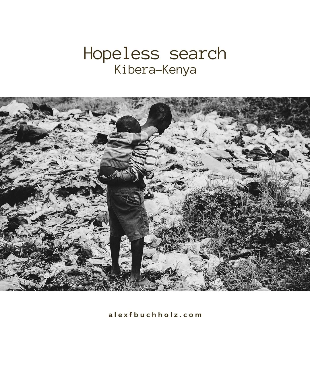 A black and white photograph of a man carrying a small child on his back through a landfill filled with trash in Kibera, Kenya. The scene conveys a sense of hardship or hopelessness.