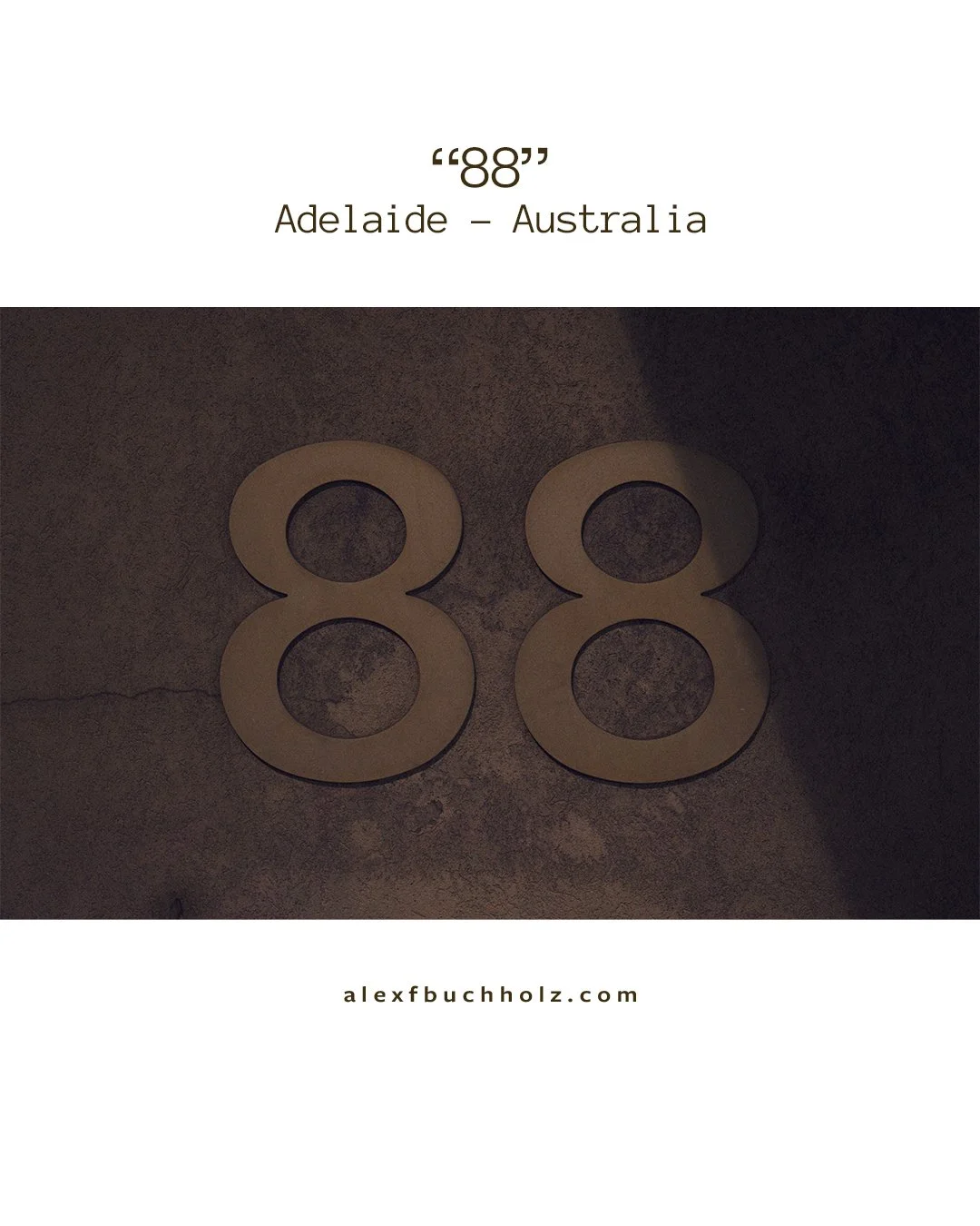 Number 88 made of wood on a dark surface with text indicating Adelaide, Australia and a website URL.