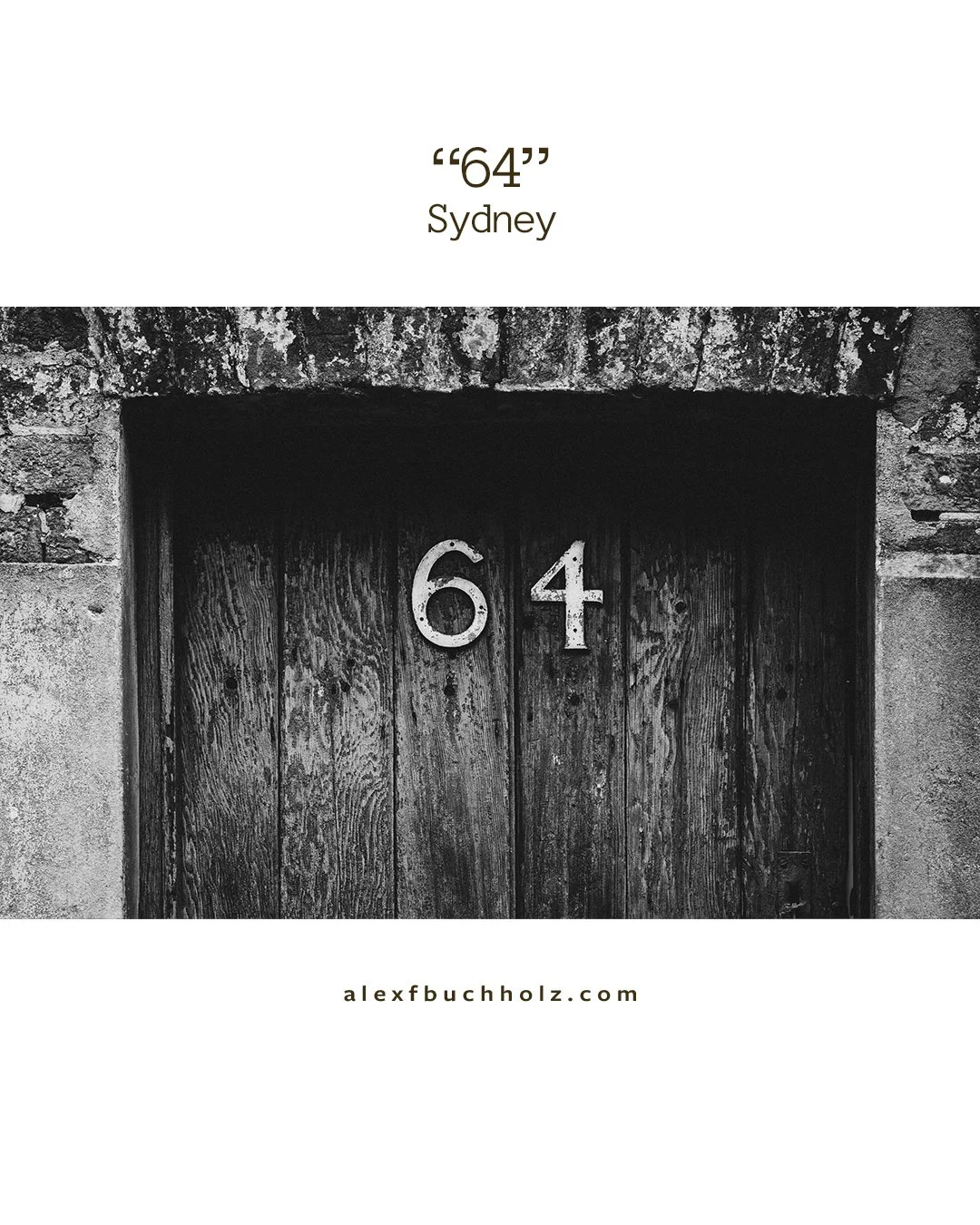 Black and white photo of a wooden door with the number 64 on it, set into a stone wall, in Sydney.