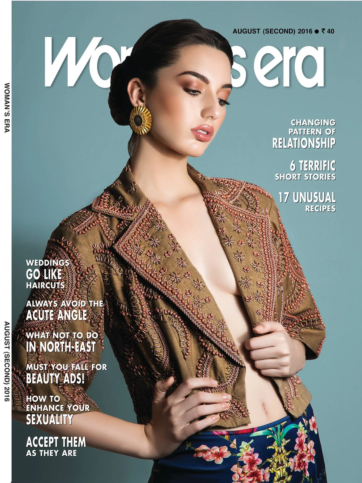 Cover of Woman's Era magazine, August 2016 issue, featuring a woman with dark hair styled in an updo, wearing large gold earrings and a patterned jacket with embroidery, against a light blue background.