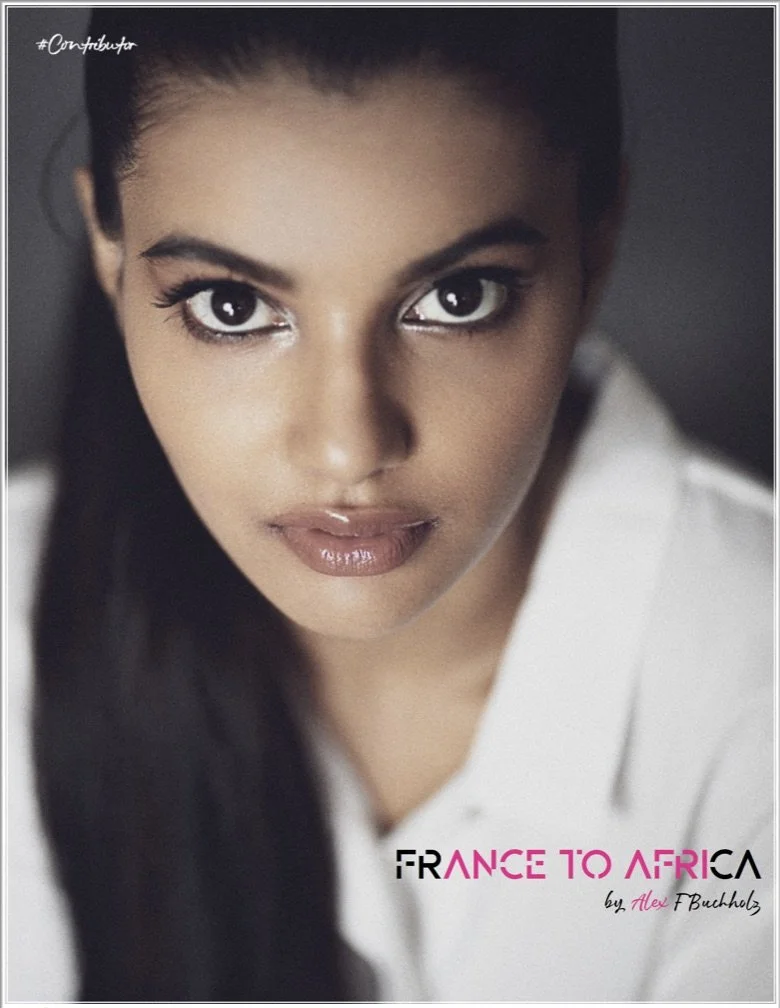 Close-up photo of a woman with dark hair and brown eyes, wearing a white shirt. Text on the image reads "France to Africa by Alex T Buchholz."