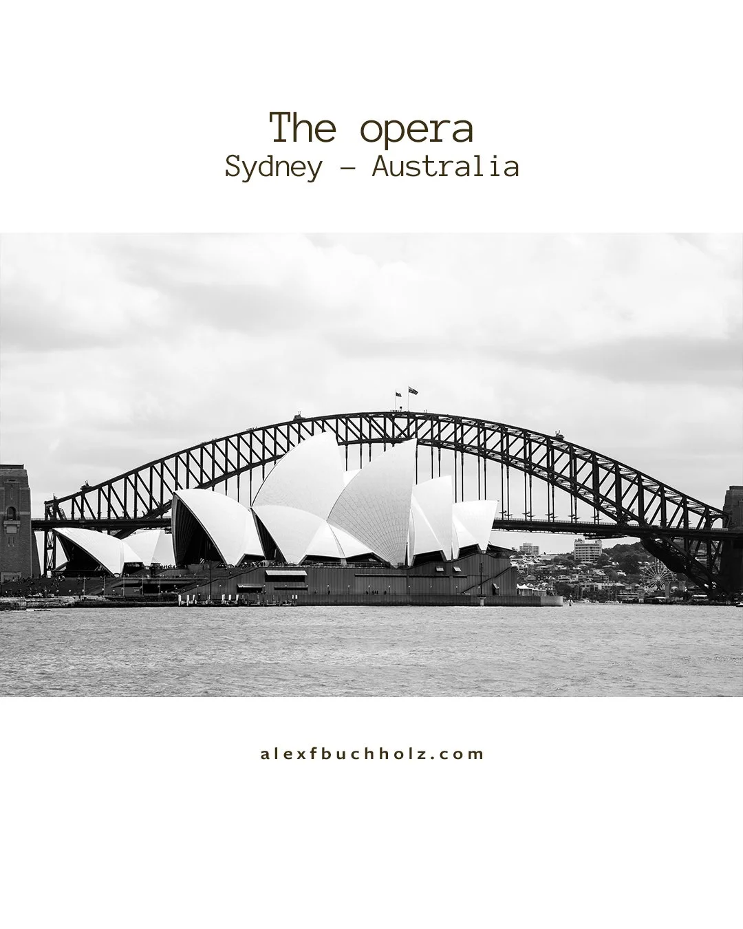 Black and white photo of the Sydney Opera House with the Harbour Bridge in the background, water in the foreground, and clouds in the sky.