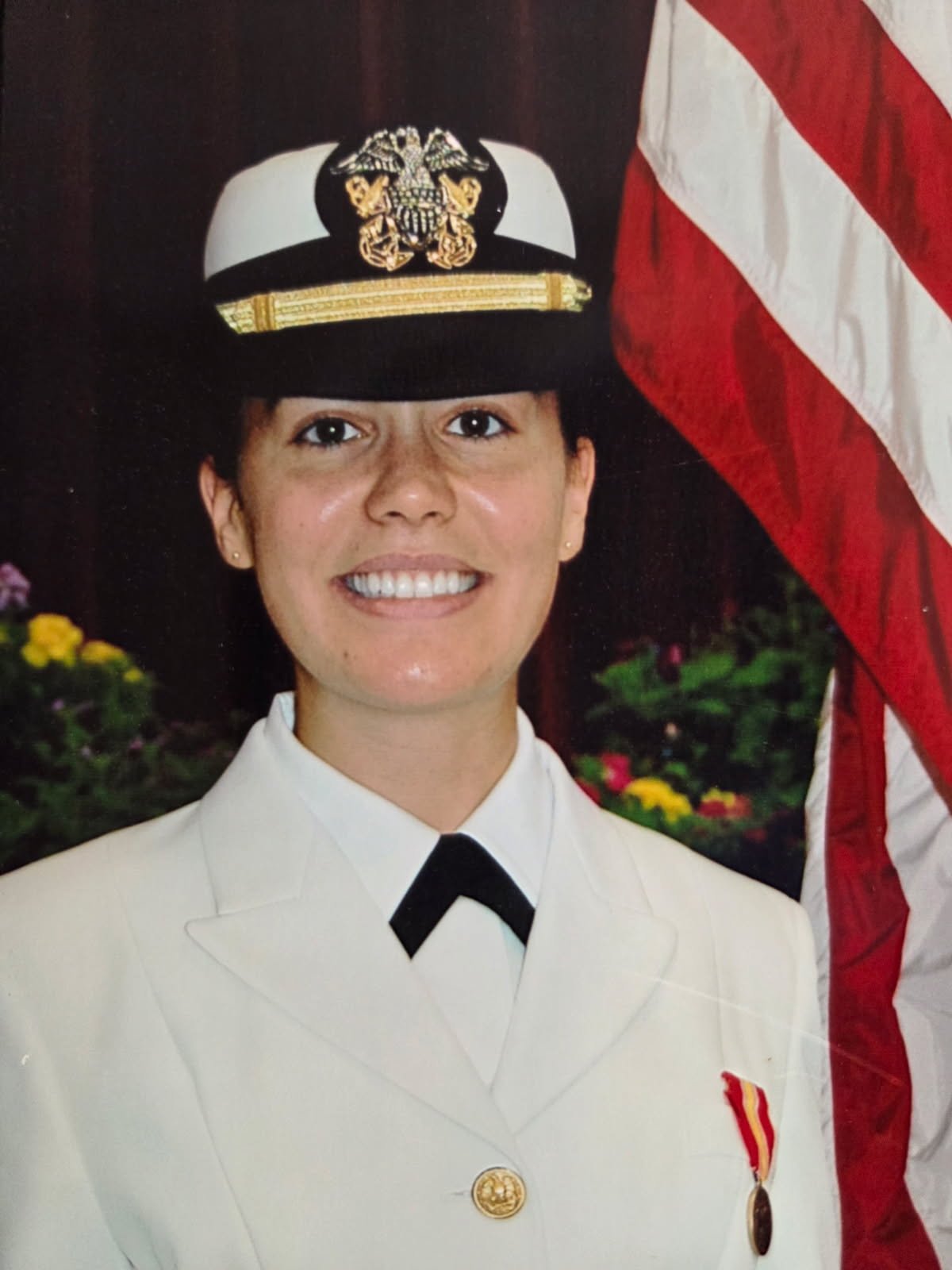 Woman wearing the US Navy Service Dress White uniform