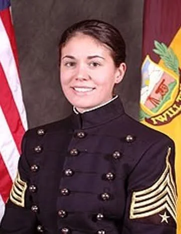 Young woman wearing U.S. Navy dress uniform