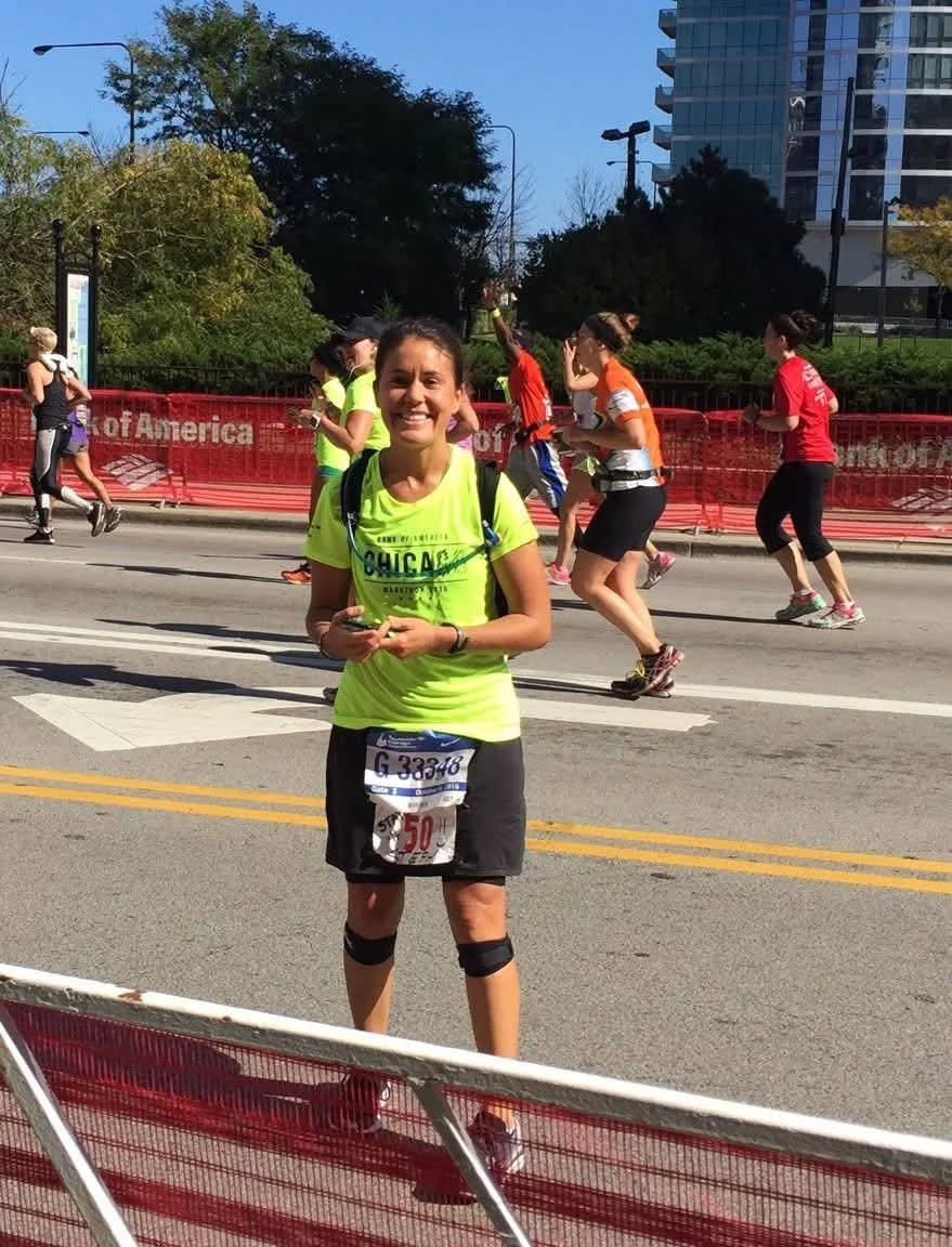 Woman poses for a photo during a marathon