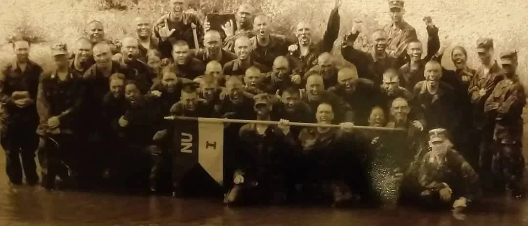Sepia toned photo of a group of U.S. armed services members at Norwich University