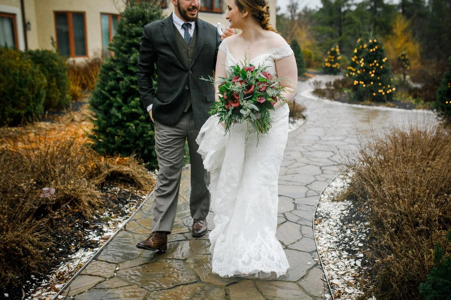 21_Bride and groom walking at Christmas wedding at Pinehills Golf Club in Plymouth, MA.jpg