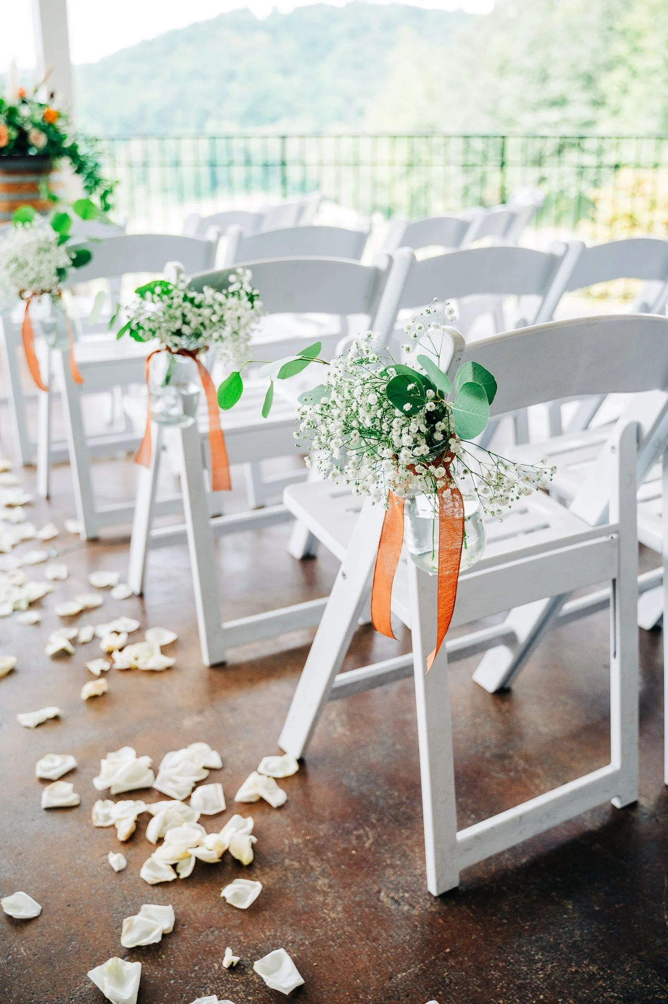 Wedding ceremony details on covered porch