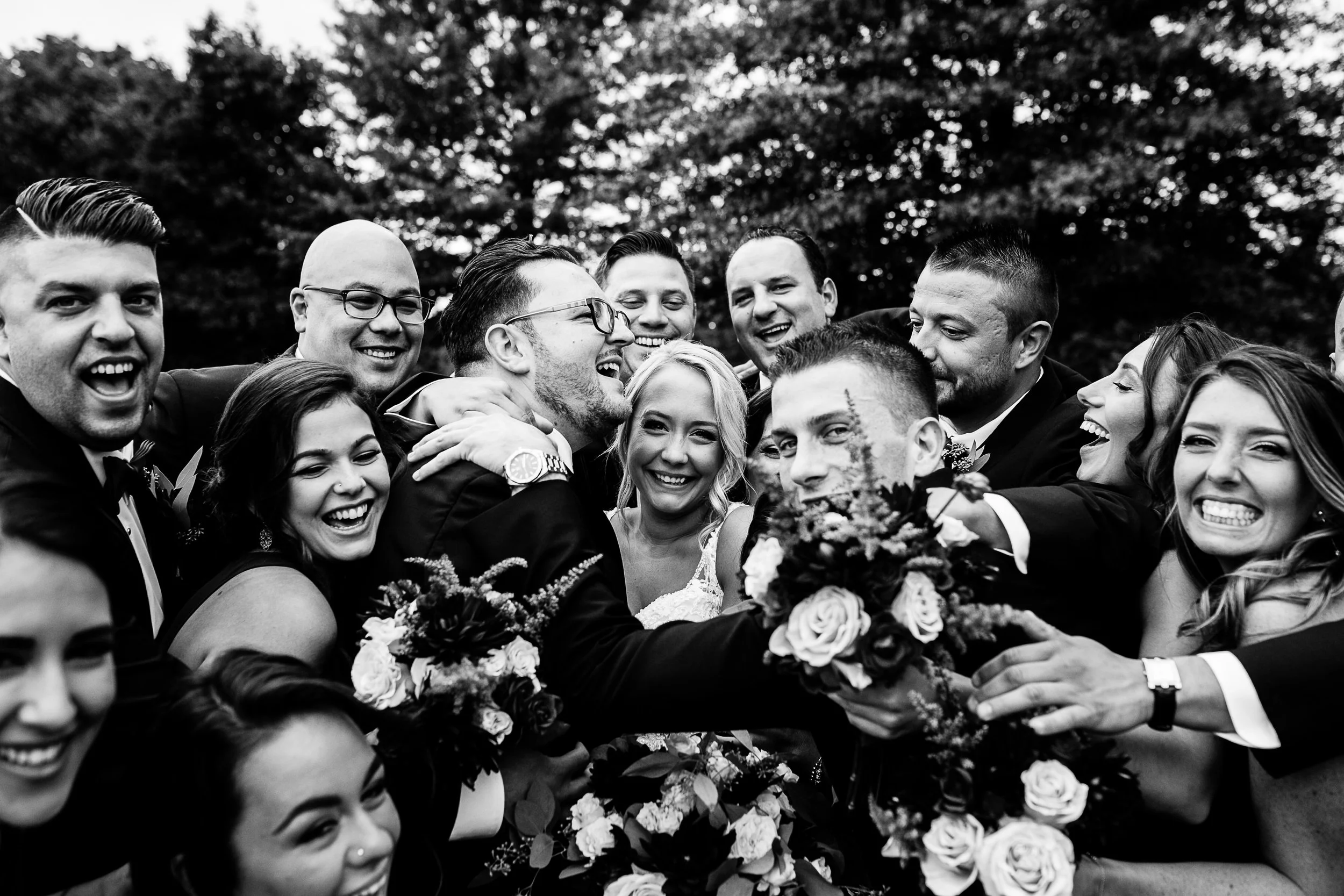 Wedding party group hug at West Hills Country Club by Sweet Alice Photography