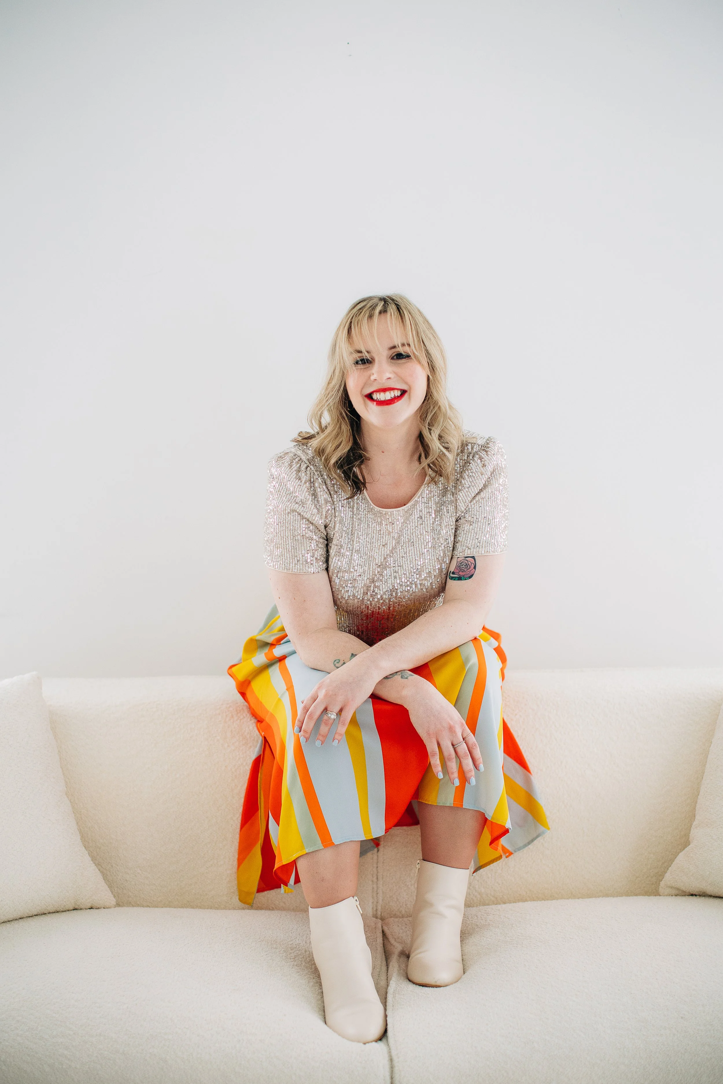 Upstate NY wedding photographer posing on a couch