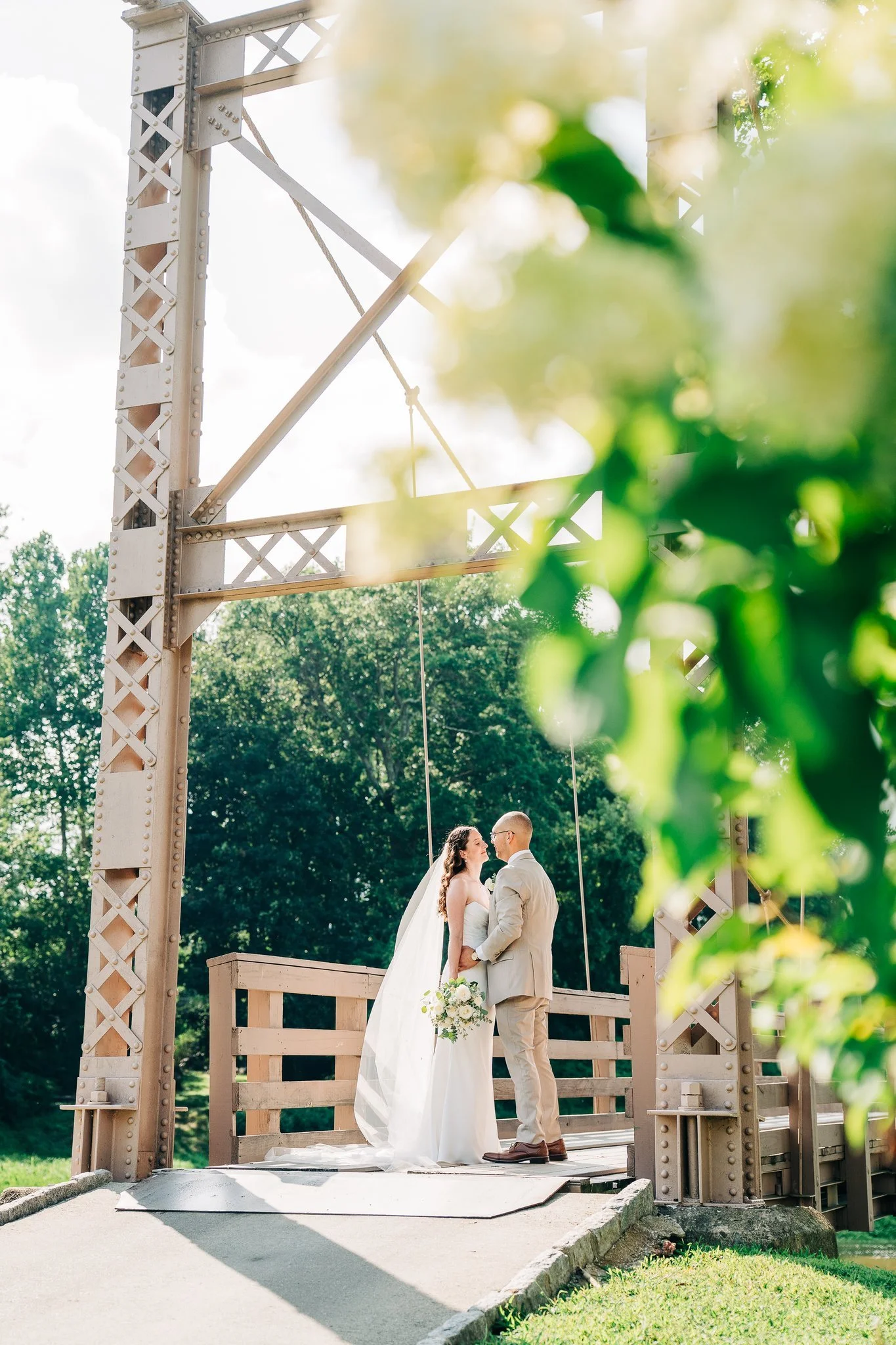 Bride and Groom posing on iconic NY bridge