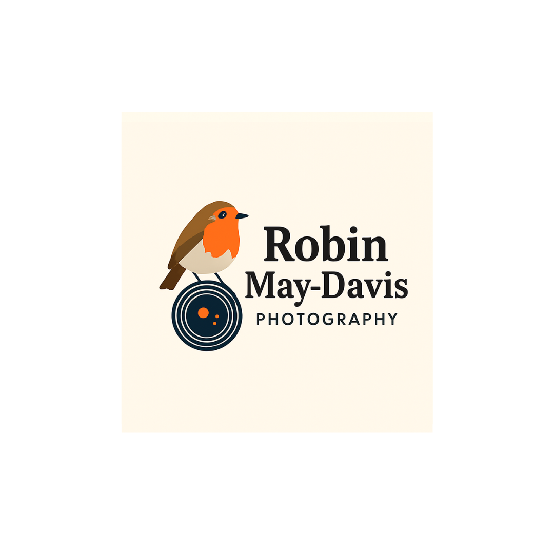 Logo for Robin May-Davis Photography featuring a cartoon robin bird perched on a camera lens with the photographer's name and profession.