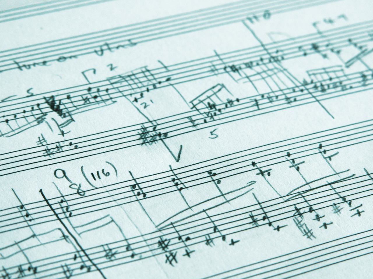 Close-up of handwritten musical notation on sheet music.