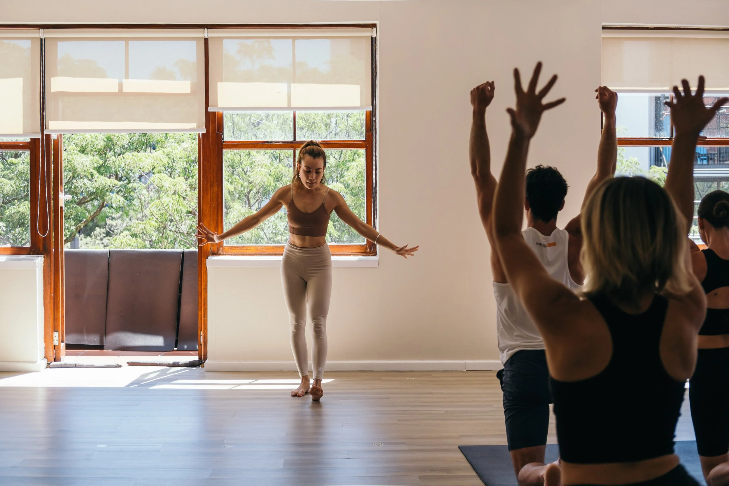 woman teaching a diverse yoga class at the best studio in Cape Town