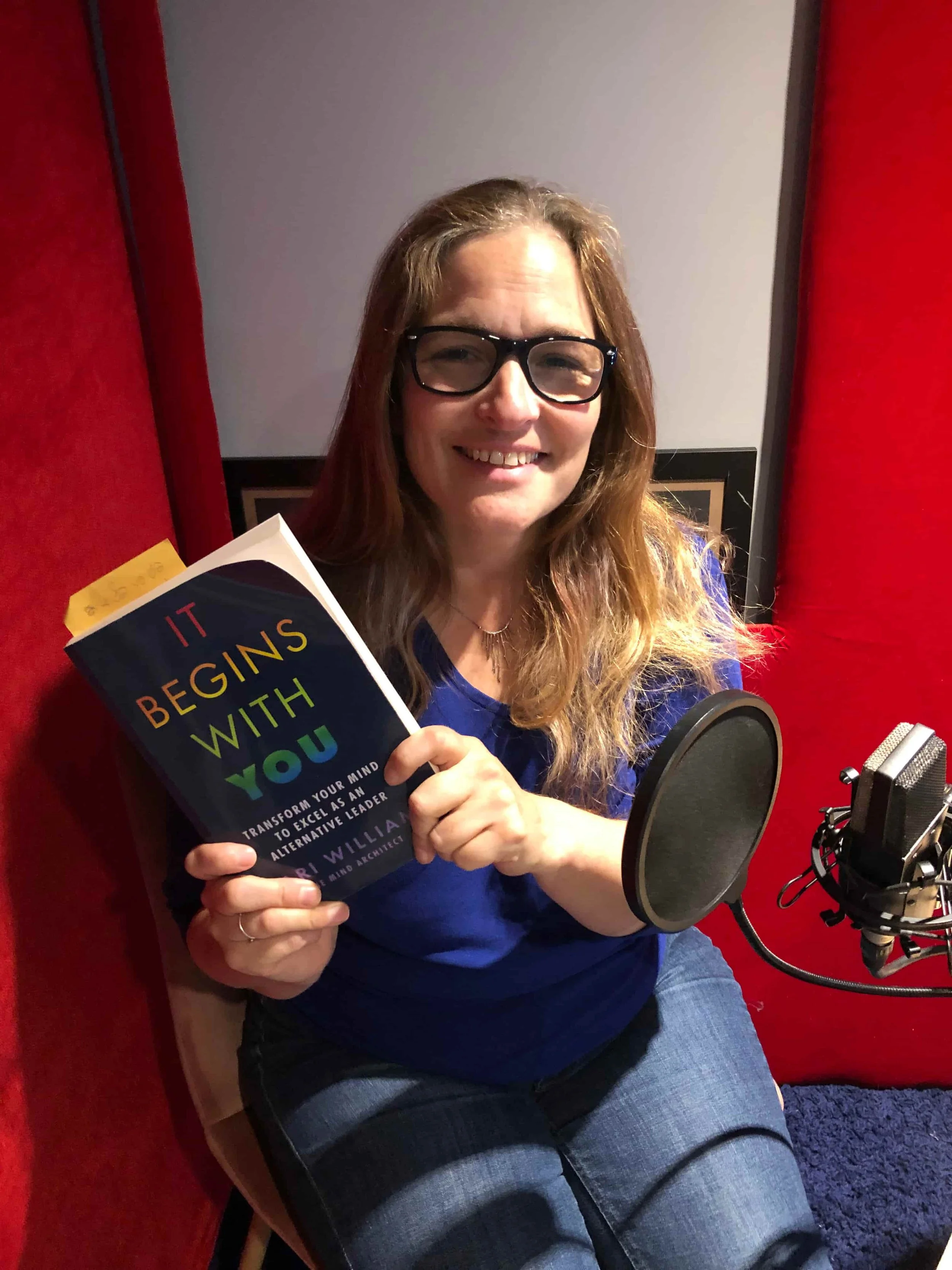 Mari Williams in recording studio, recording the audio for her book, It begins with you