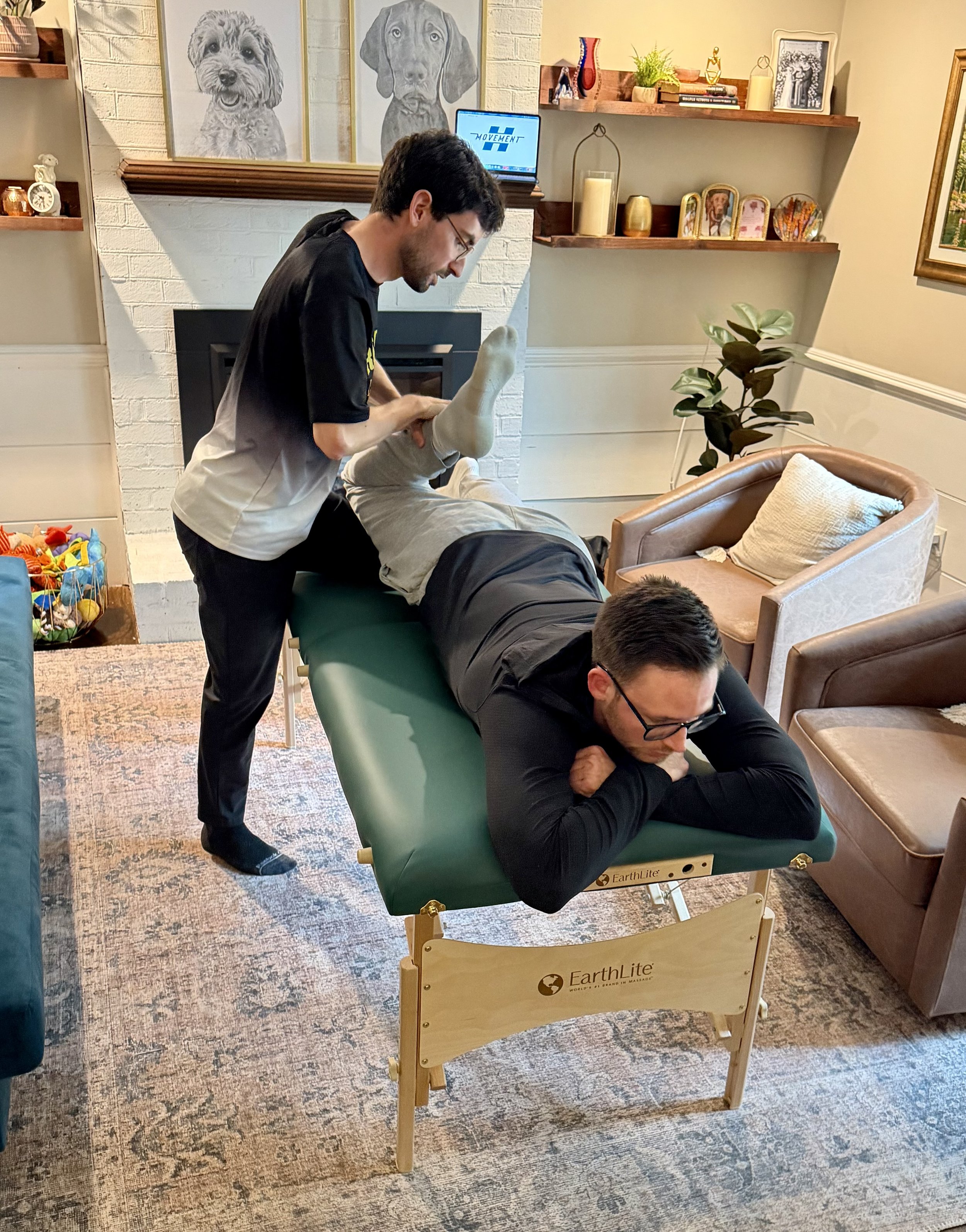 Hall Movement coach performing assisted stretching on client at home - mobile stretching service Richmond VA