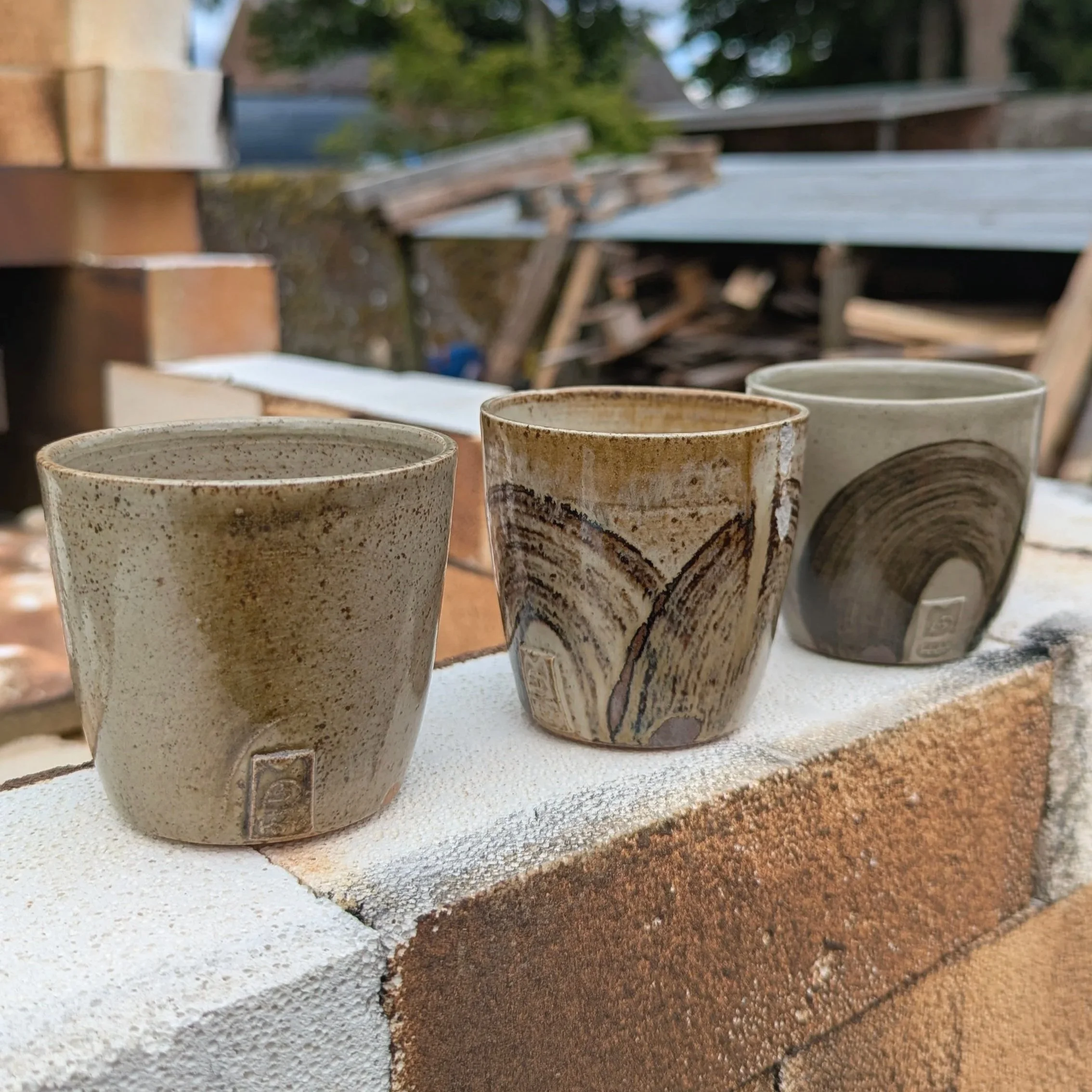 Fast fired stoneware cups with foraged clay slip, July 2026