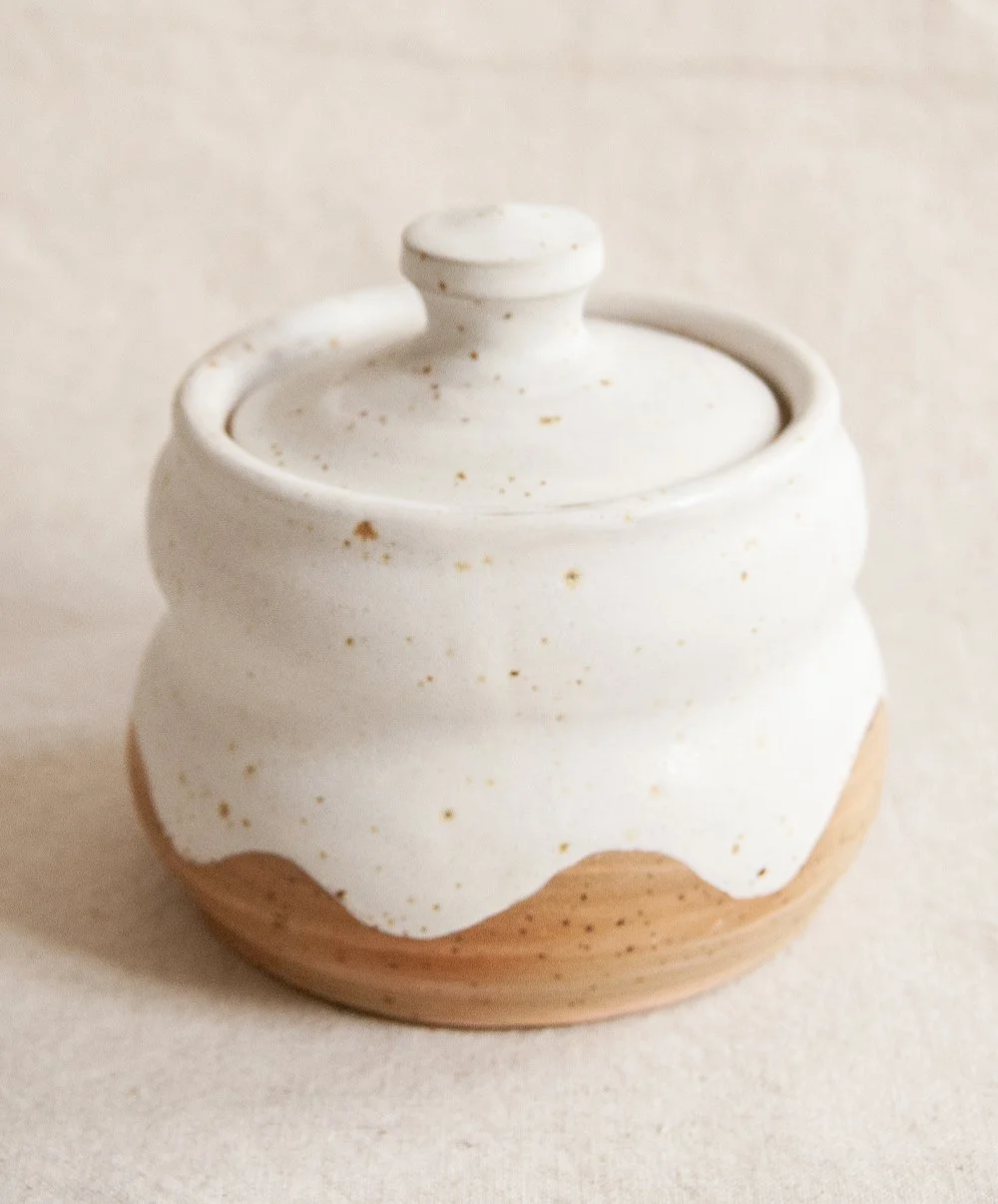 Curved lidded pot, spotted / pink clay with matte white glaze