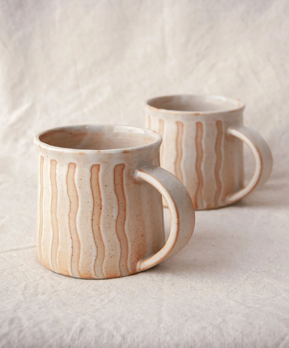 Shino-glazed gas fired mugs