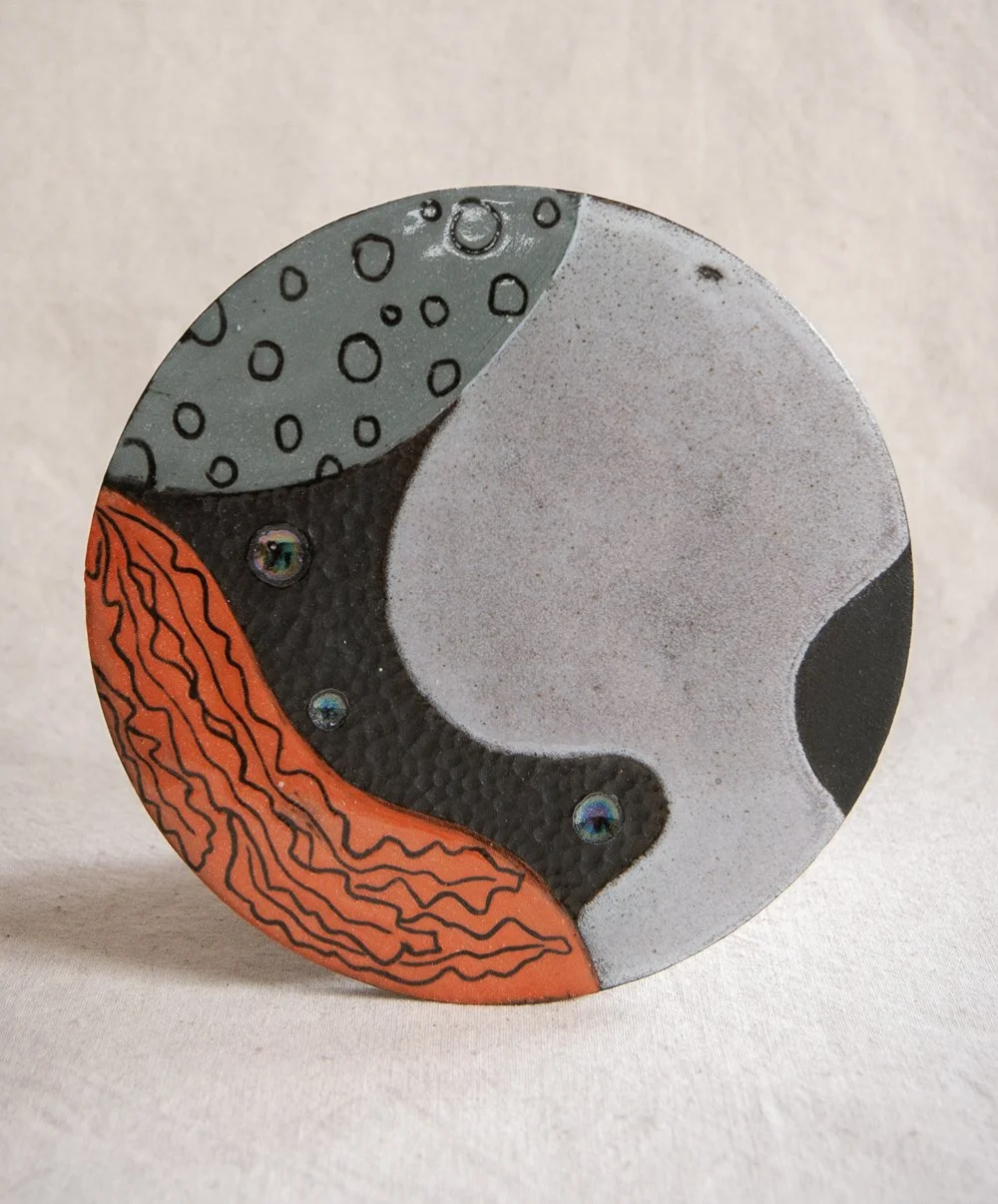 Black 'Rockpool' wall hanging with turquoise glaze and lustre detail