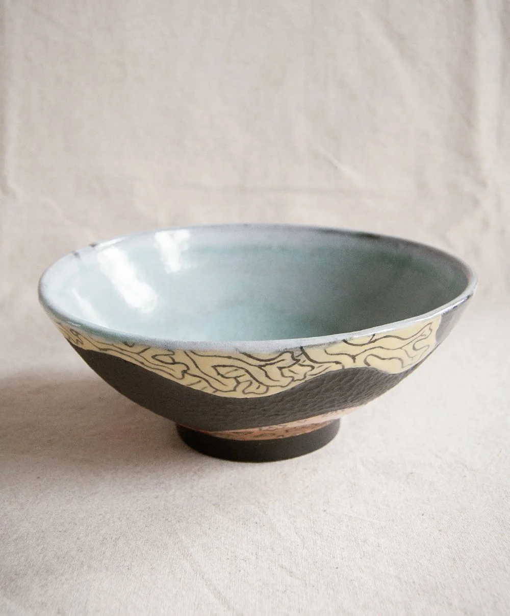 Black 'Rockpool' stoneware bowl with turquoise glaze