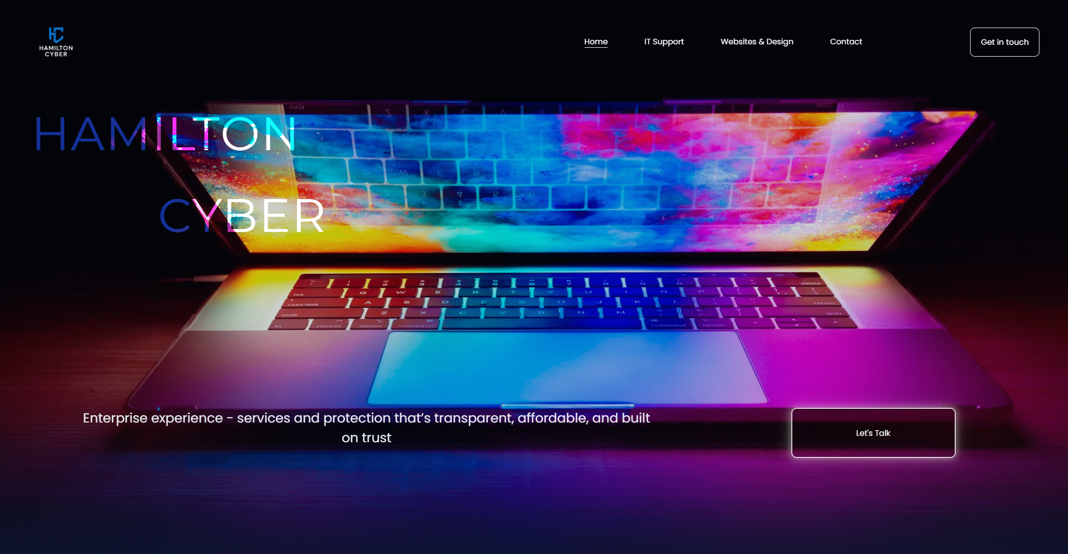 Homepage of Hamilton Cyber website featuring a colorful laptop with a vibrant display and a dark background. Navigation menu includes Home, IT Support, Websites & Design, Contact, and a Get in touch button. The text reads 'HAMILTON CYBER' and 'Enterprise experience – services and protection that’s transparent, affordable, and built on trust.' A call-to-action button says 'Let’s Talk'.