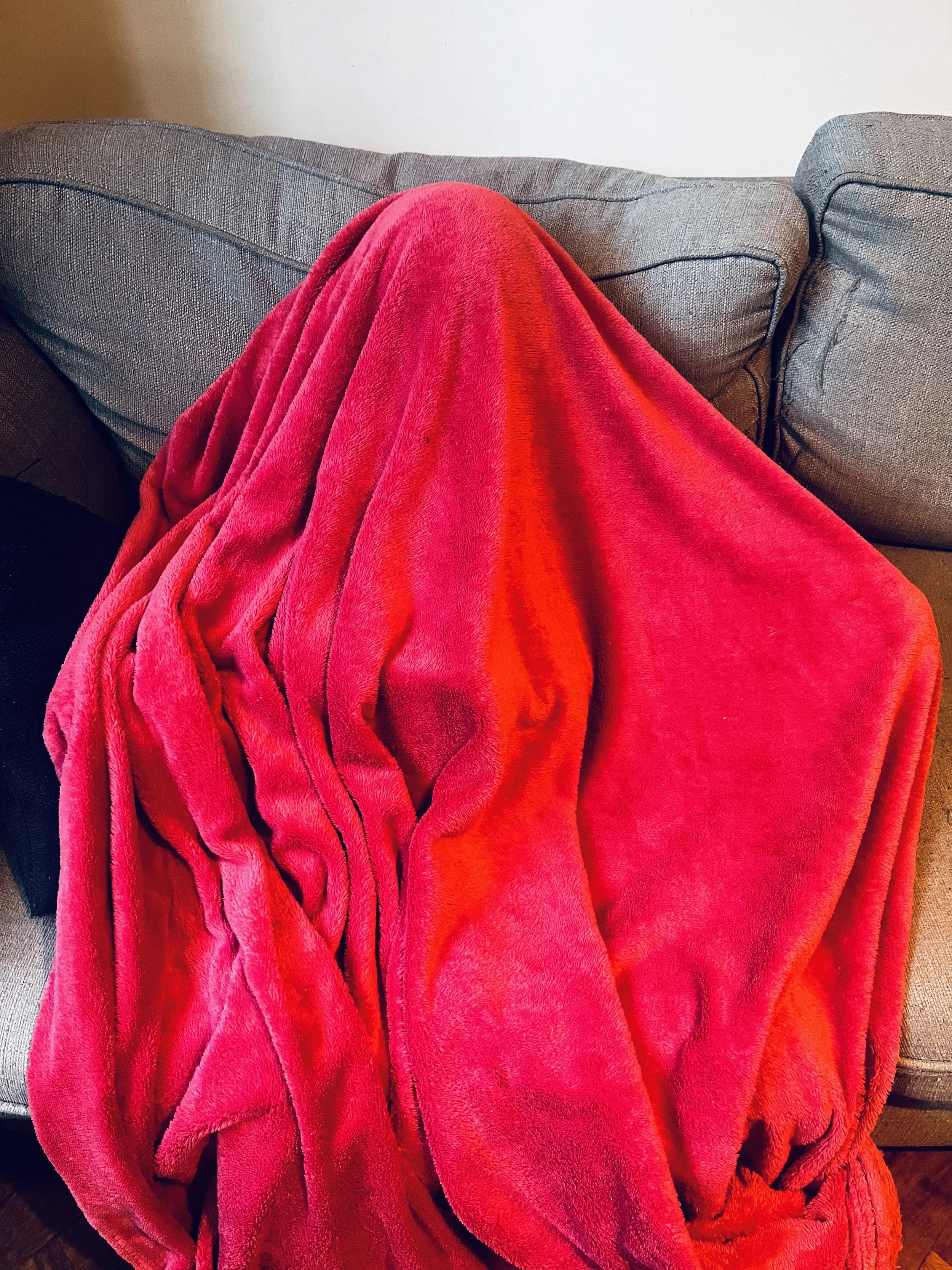 Ro, 8: Photograph taken by Ro's parent. 
Ro is currently being assessed for suspected ADHD, ASD and PDA. She is only able to attend school for 15 minutes a day and then hides under ‘pinky’ until she feels able to face the world.