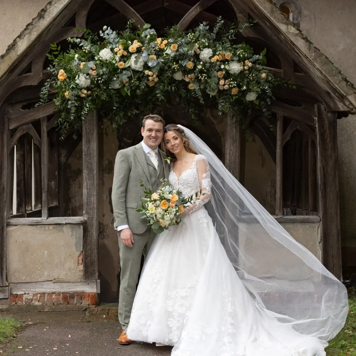A week of rain, grey skies and muddy forecasts&hellip; and then, just as guests spilled out of the church, the clouds parted long enough for the confetti moment of dreams.

That floral arch framed the entrance like it had always belonged there - soft