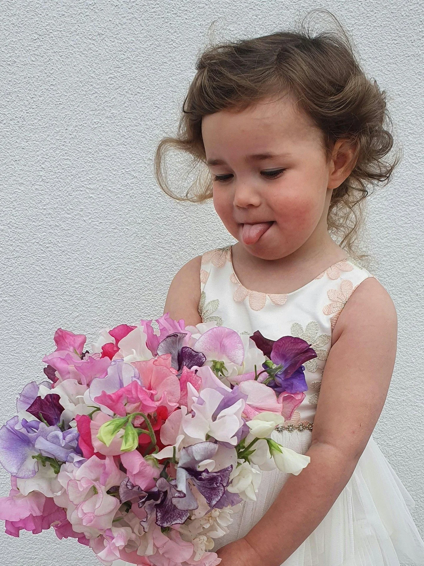 Years ago, Evie, insisted on holding one of my posies of sweet peas so she could model for my social media.  She stood there so proudly, clutching the flowers I&rsquo;d just made, completely convinced she was part of the team - and honestly&hellip; s