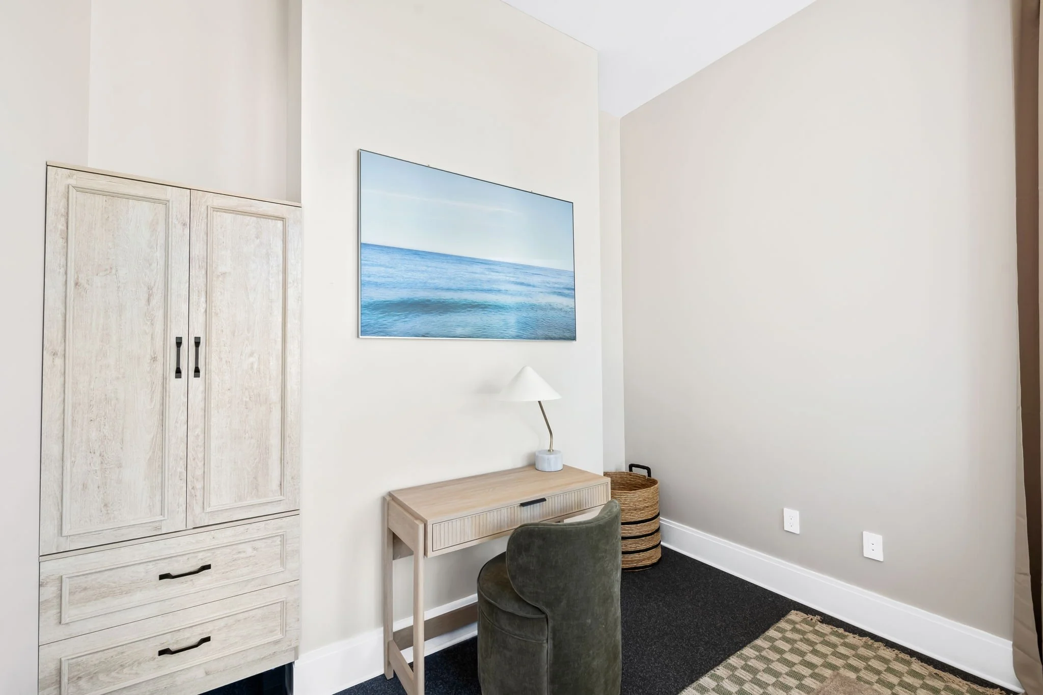 Stylish study nook with velvet chair and ocean photography — luxury vacation home, Sun Haven Collection.