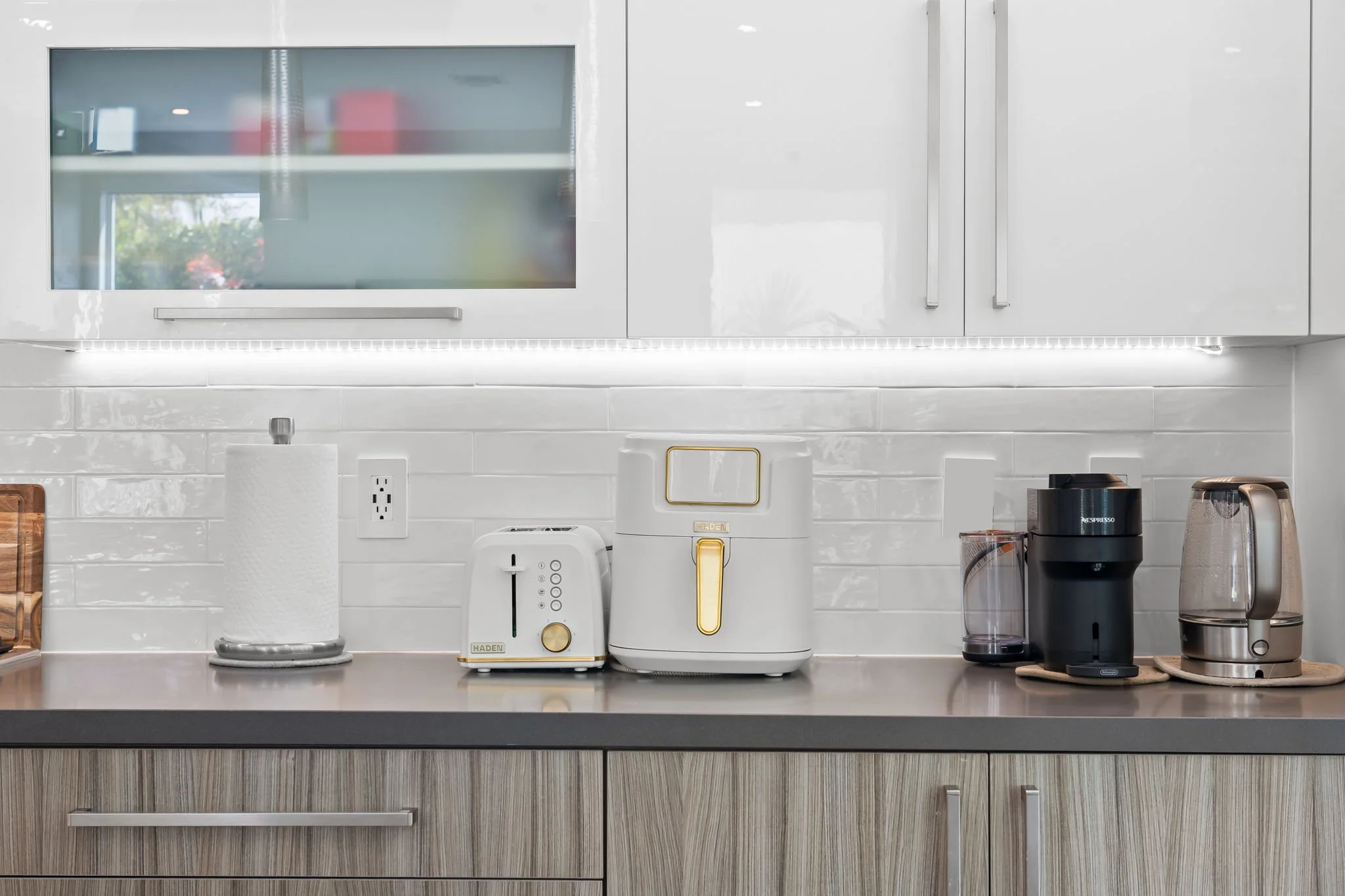 Kitchen with coffee station, toaster, and premium appliances — Sun Haven Collection vacation rental.