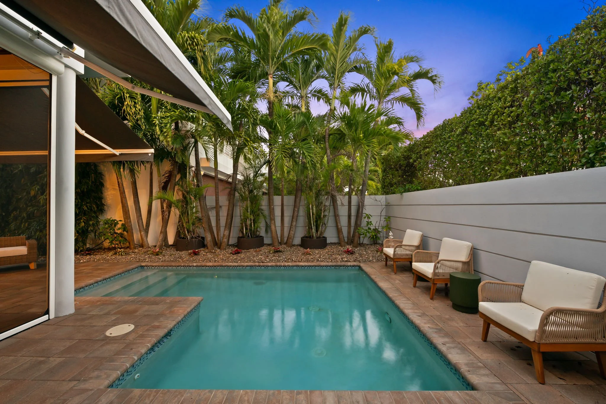 Luxury vacation home with brick driveway at sunset — Sun Haven Collection rental, Fort Lauderdale.