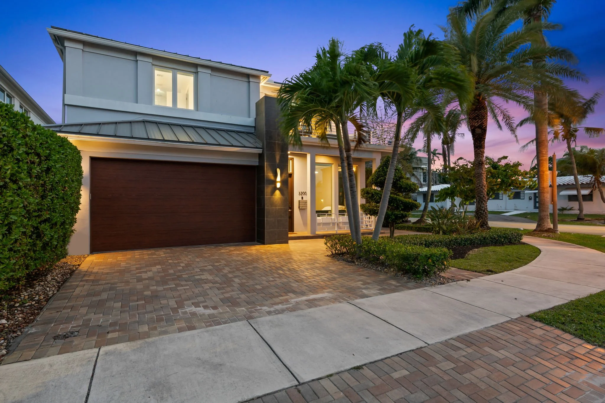 Welcoming porch entrance with outdoor lighting — Sun Haven Collection luxury vacation rental.
